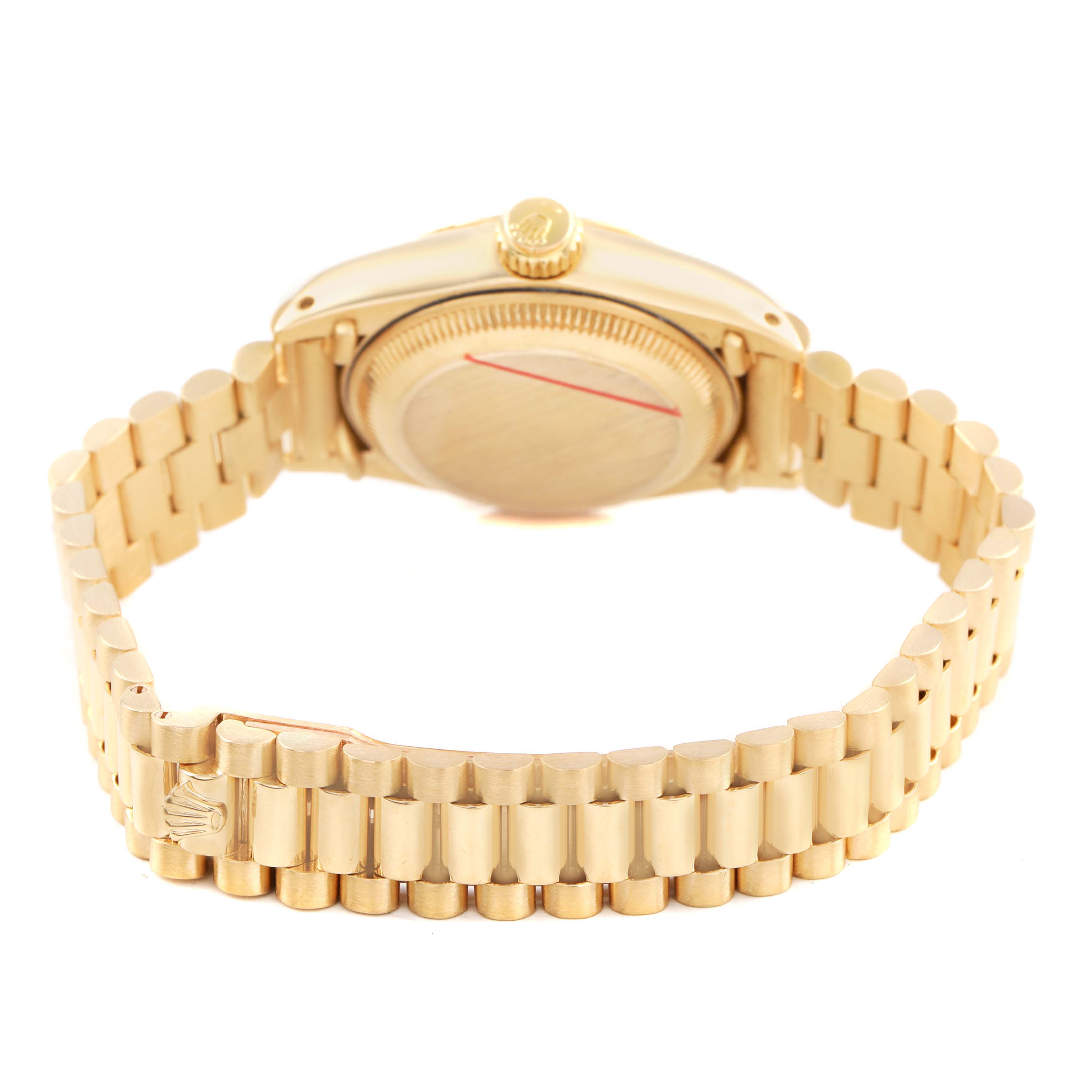 The Rolex President 6917 Women's Yellow Gold Champagne Dial watch is shown from a rear angle, displaying the bracelet, clasp, and case back.