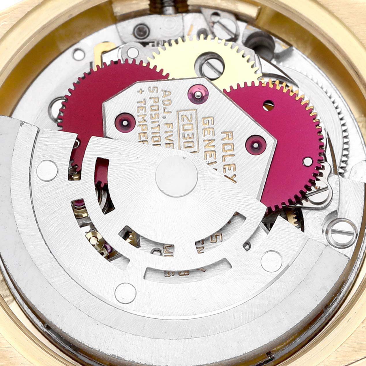 The image shows the internal mechanics of a Rolex President 6917 Women's Yellow Gold Champagne Dial model, focusing on gears and the rotor.