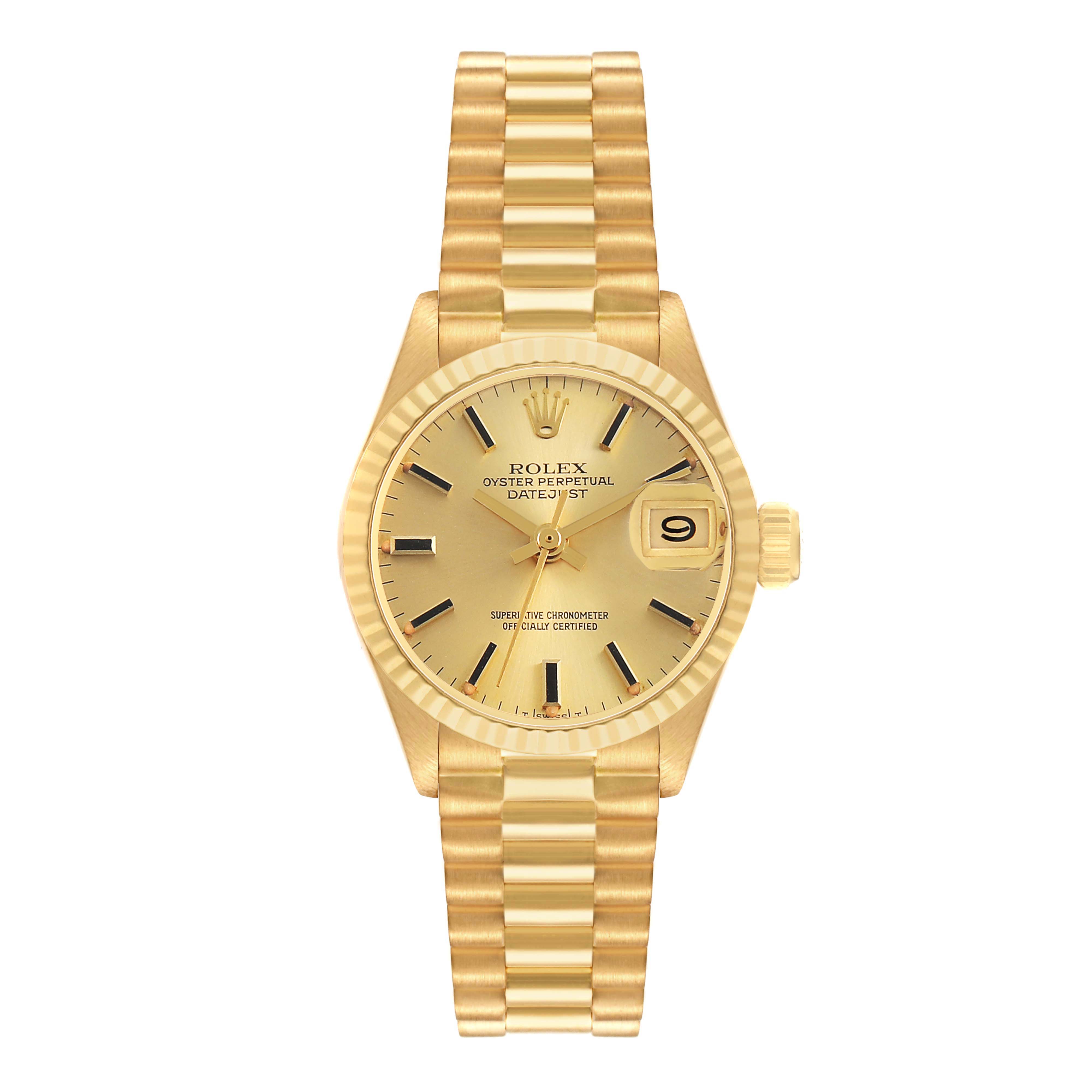 The Rolex President 6917 Women's Yellow Gold Champagne Dial watch is shown from a top-down angle, highlighting its face, fluted bezel, bracelet, and crown.