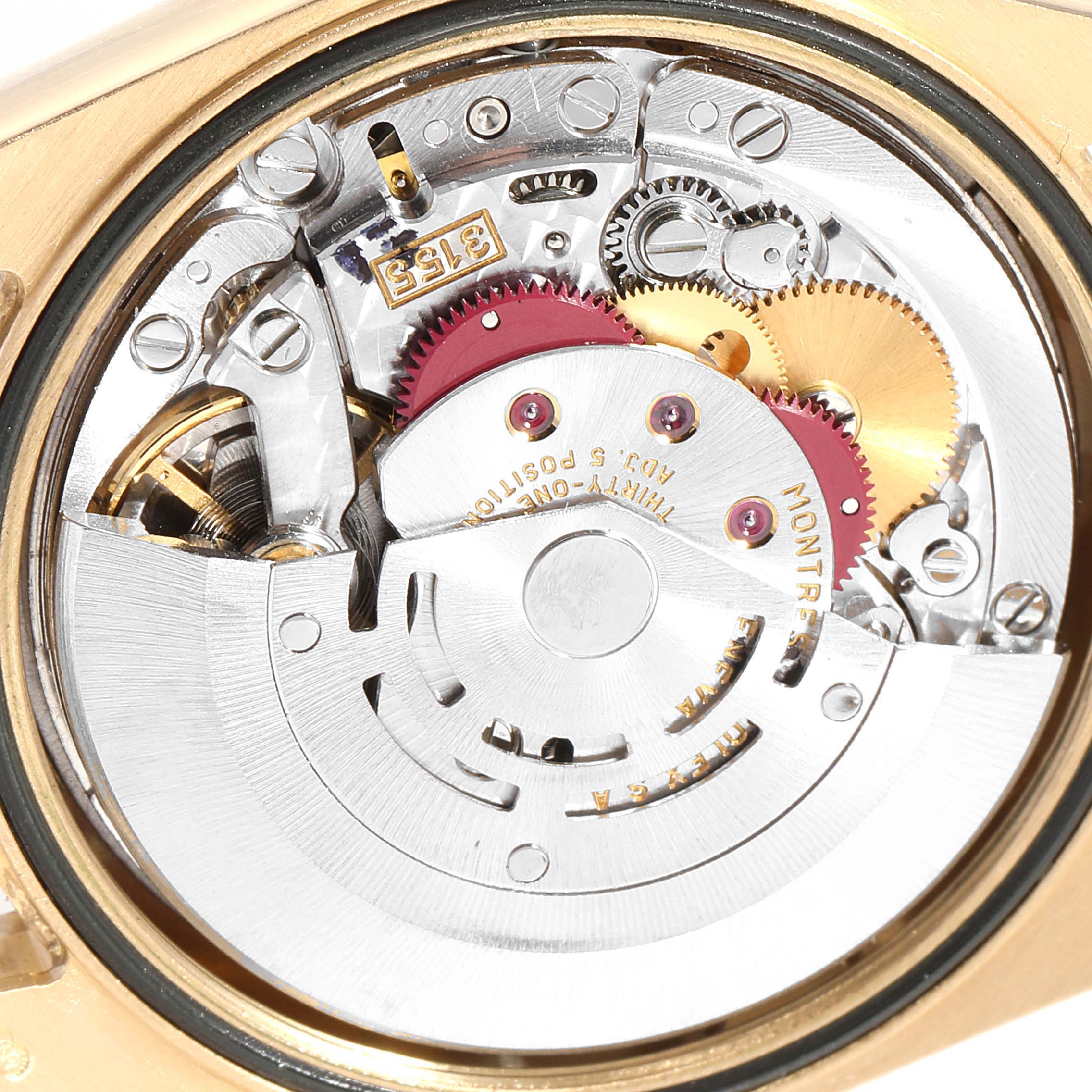 The image shows the internal mechanism and gears of the Rolex President 118238 Men
s Yellow Gold White Dial 118238 Men
s Yellow Gold White Dial model watch from a back angle.