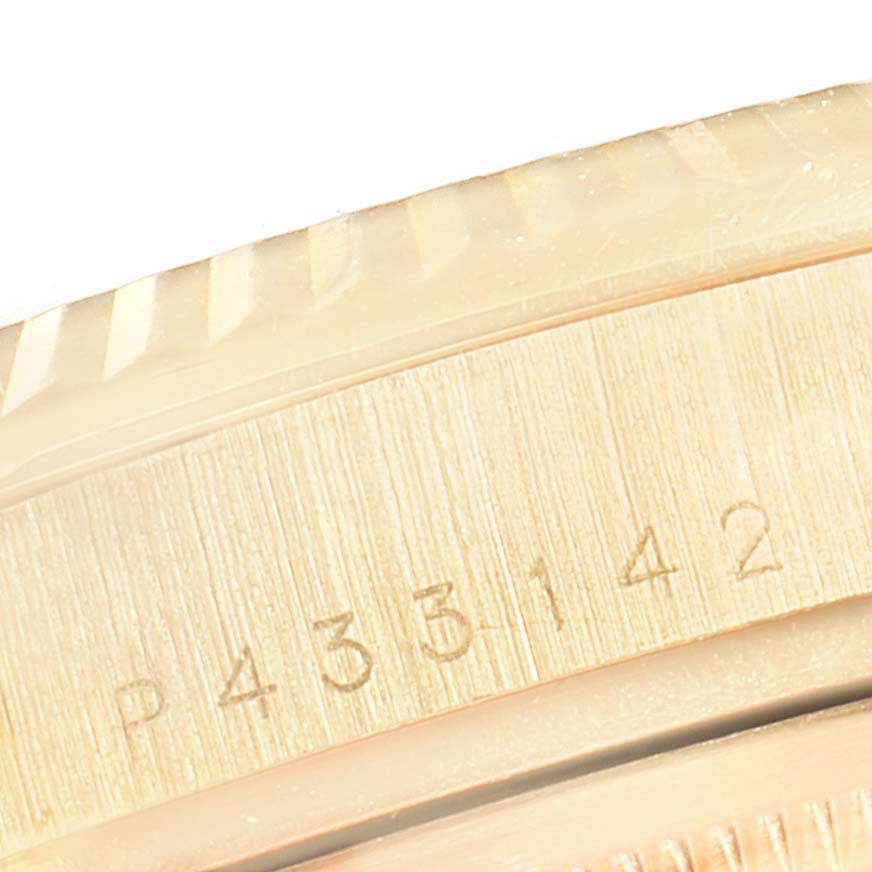 This image shows a close-up of the caseback and part of the fluted bezel on a Rolex President 118238 Men
s Yellow Gold White Dial 118238 Men
s Yellow Gold White Dial model watch.