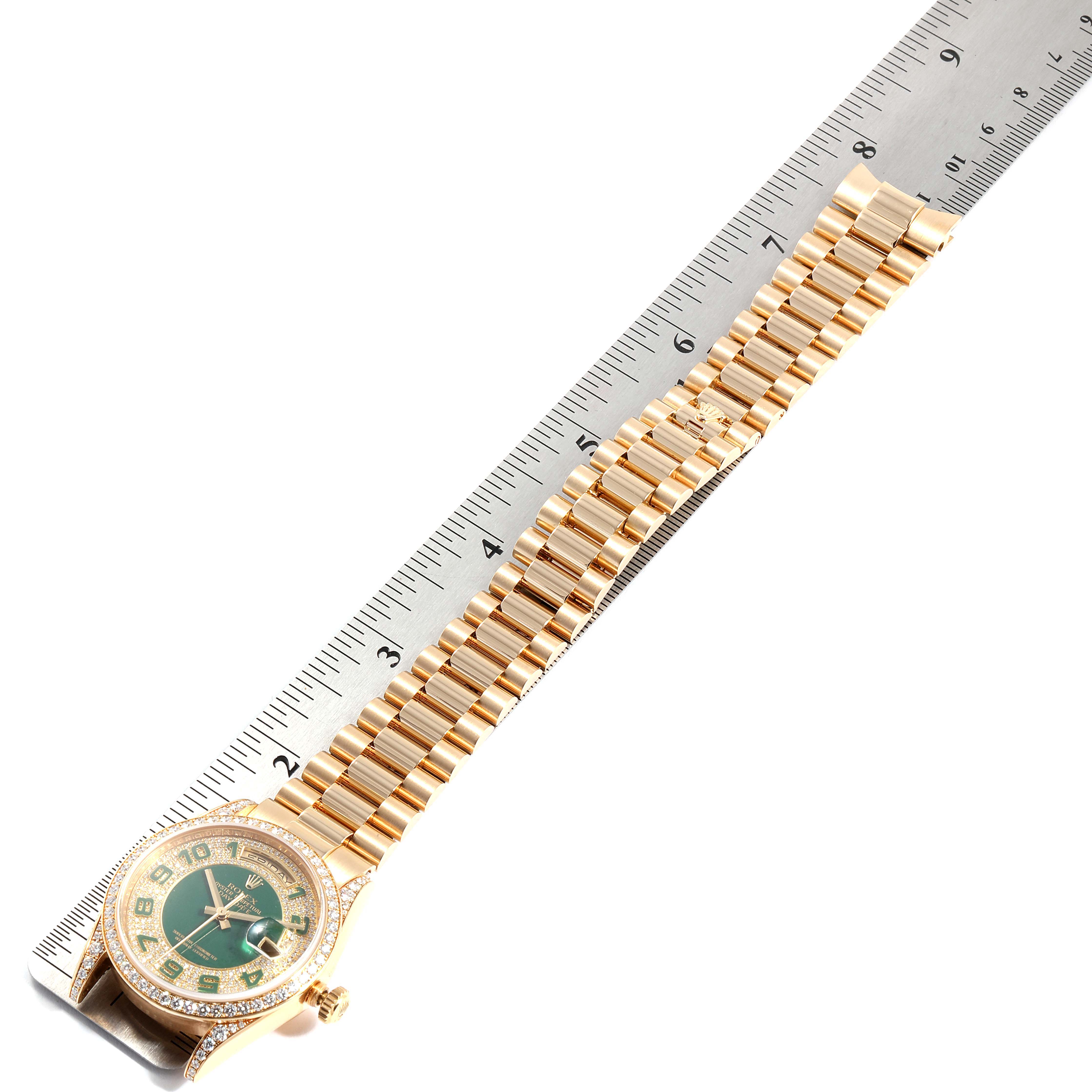 The image shows a Rolex President 118388 Men's Yellow Gold Green Dial 118388 Men's Yellow Gold Green Dial model watch laid flat next to a ruler, displaying the face and full length of the gold bracelet.