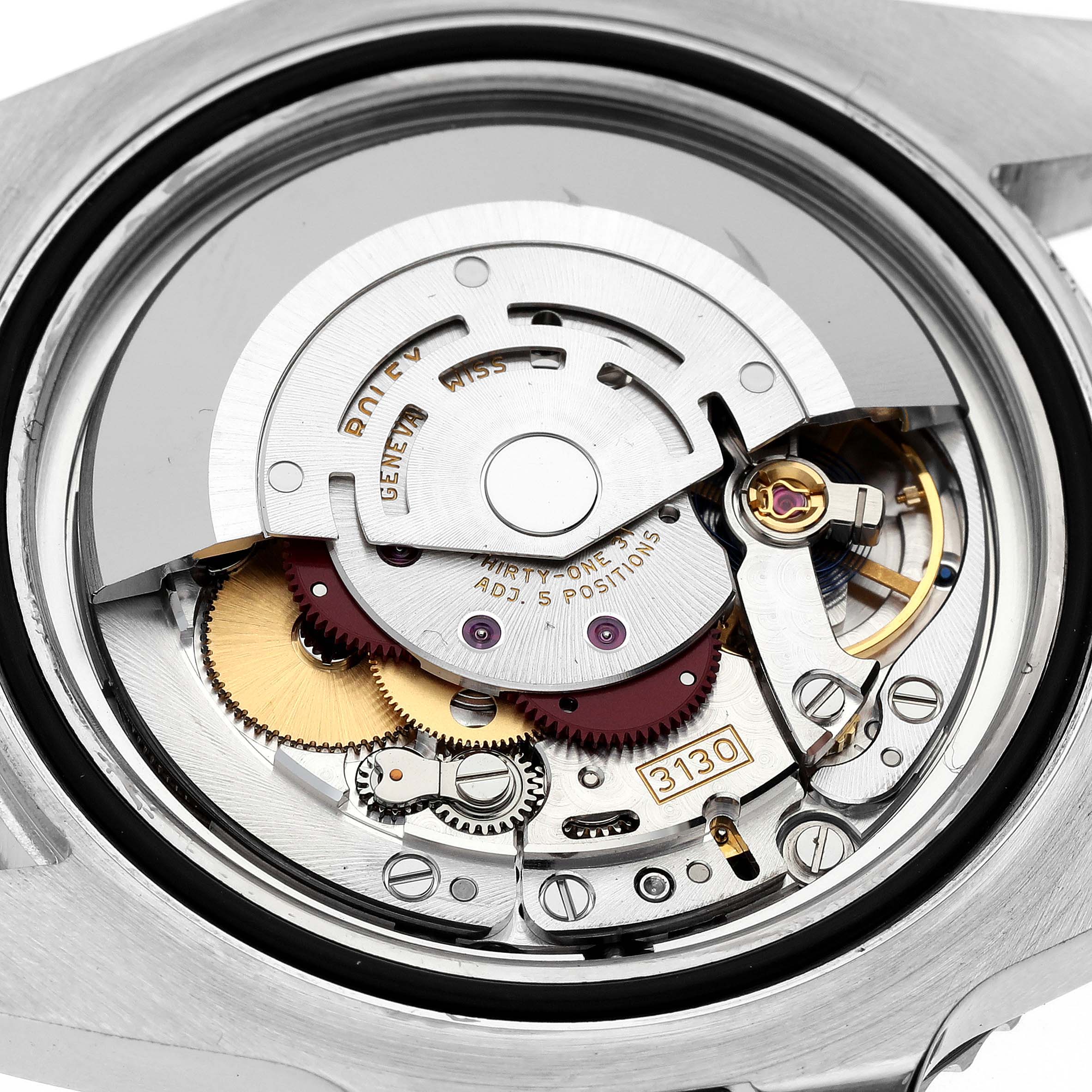 A close-up view of the movement inside a Rolex Submariner 114060 Men
s Stainless Steel Black Dial 114060 Men
s Stainless Steel Black Dial, showing the intricate gears and components.