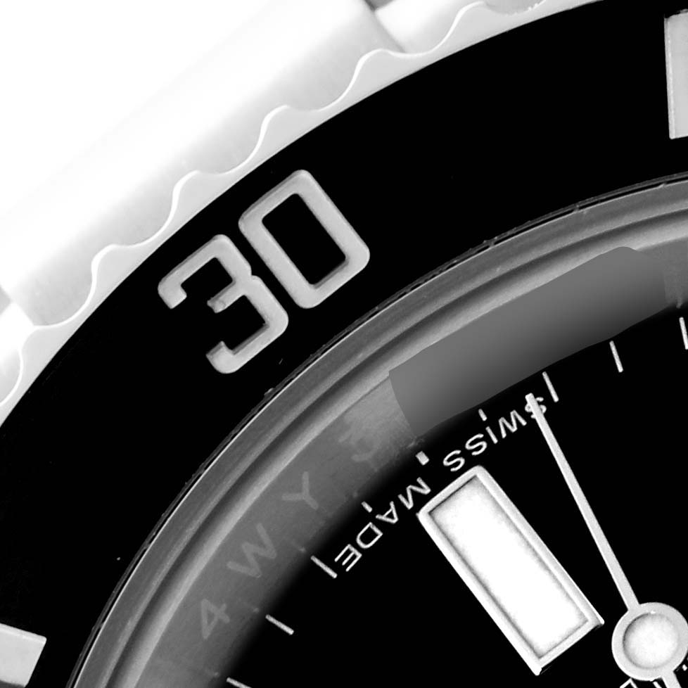 This close-up image shows the bezel and part of the dial of a Rolex Submariner 114060 Men
s Stainless Steel Black Dial 114060 Men
s Stainless Steel Black Dial watch, with the "30" marking and "Swiss Made" text visible.