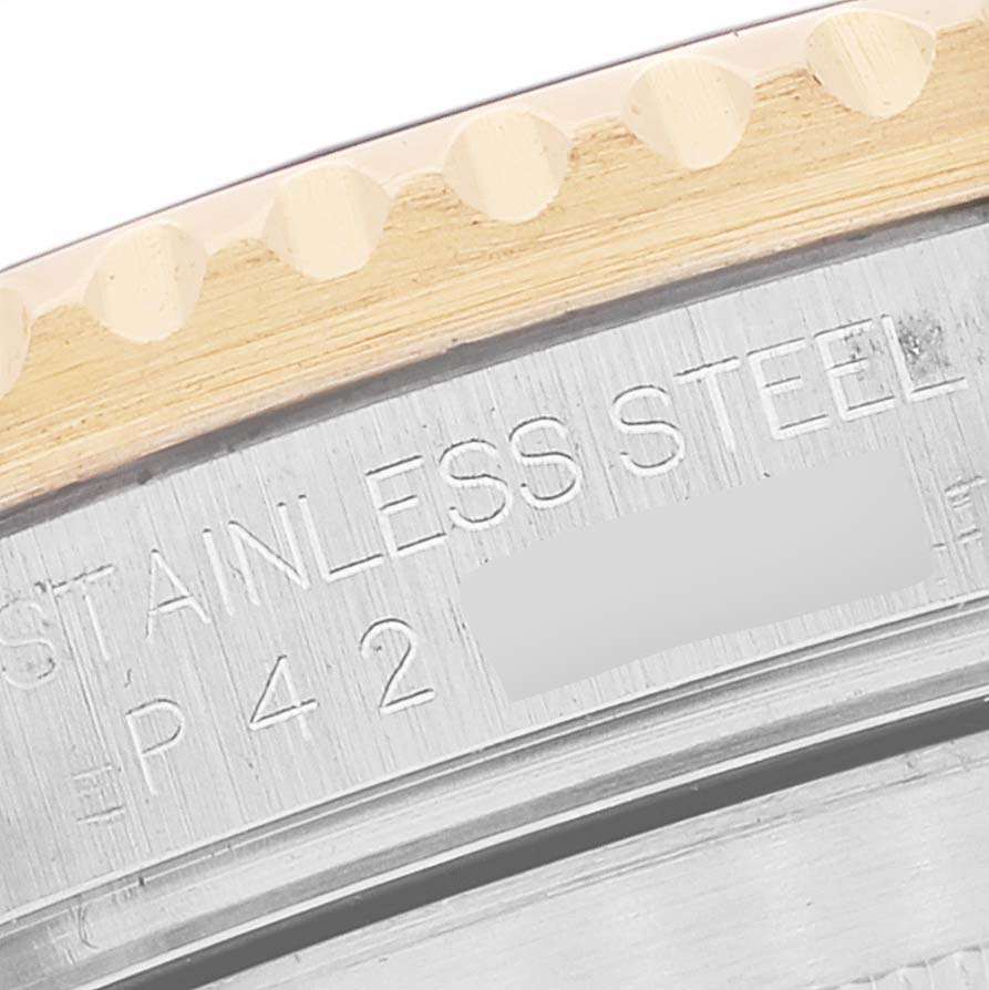 This image shows a close-up of the stainless steel case back and gold bezel of the Rolex Submariner 16613 Men's Steel and Gold (two tone) Blue Dial 16613 Men's Steel and Gold (two tone) Blue Dial watch.