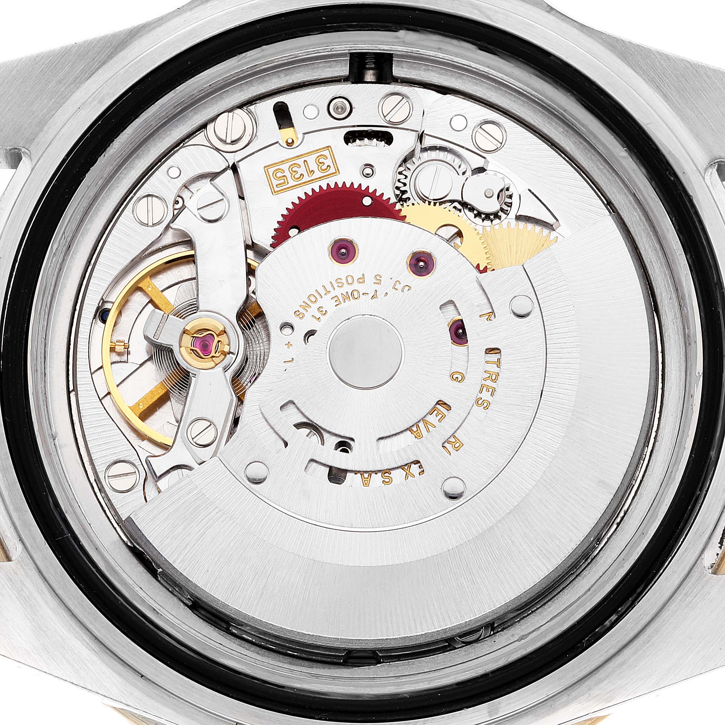 This image shows the inner mechanics and movement of a Rolex Submariner 16613 Men's Steel and Gold (two tone) Blue Dial 16613 Men's Steel and Gold (two tone) Blue Dial watch from a close-up, rear angle.