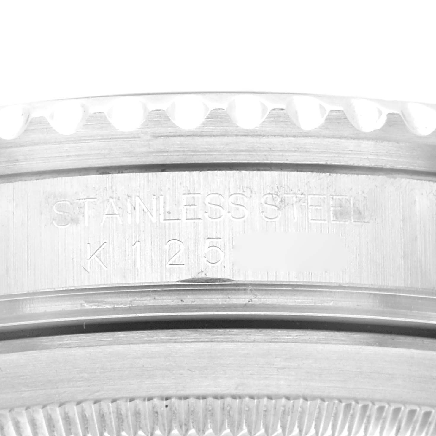 The image shows a close-up angle of the stainless steel casing edge of a Rolex Submariner 16610 Men
s Stainless Steel Black Dial 16610 Men
s Stainless Steel Black Dial watch.