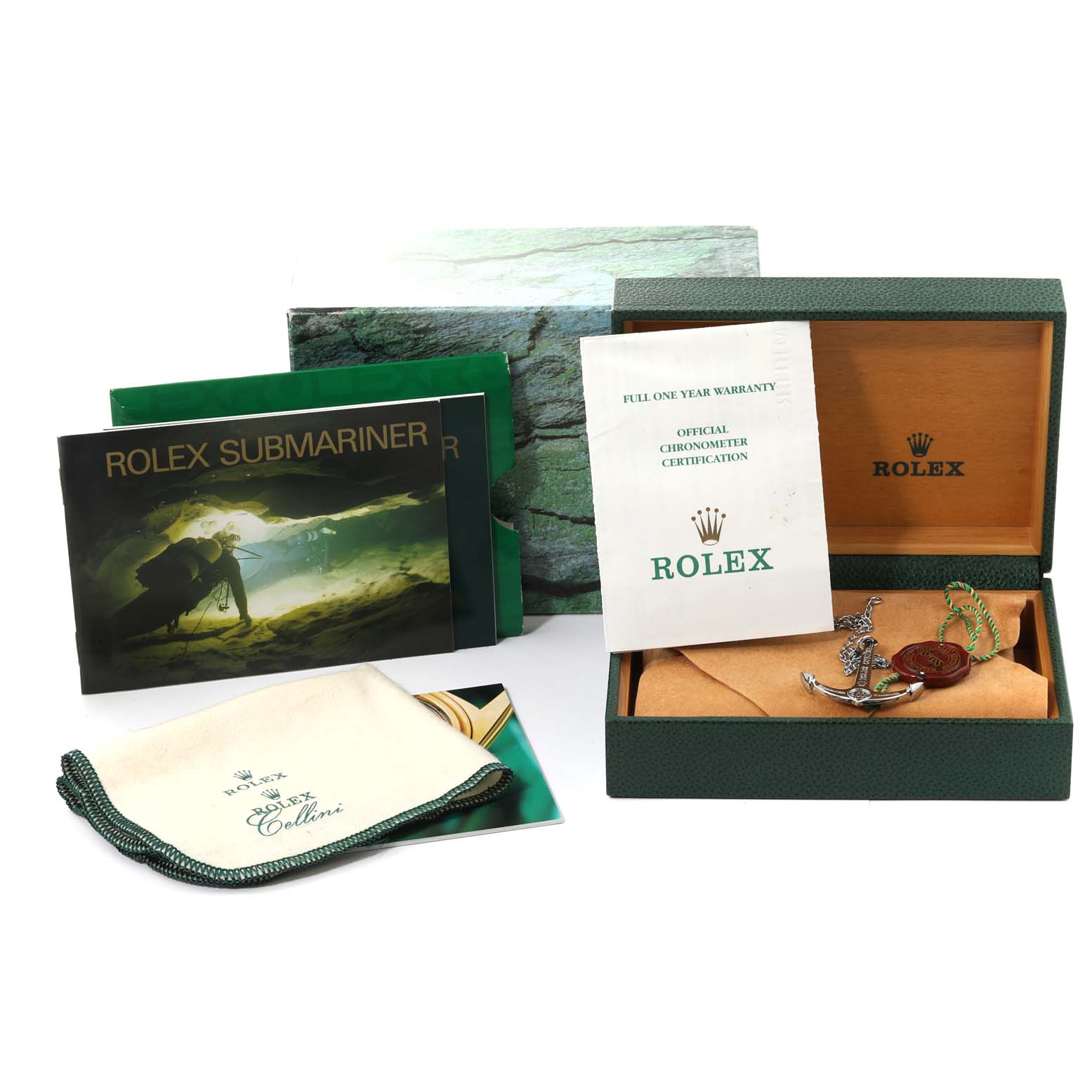 The image shows accessories for a Rolex Submariner 16610 Men
s Stainless Steel Black Dial 16610 Men
s Stainless Steel Black Dial, including the box, manuals, warranty card, and cleaning cloth.