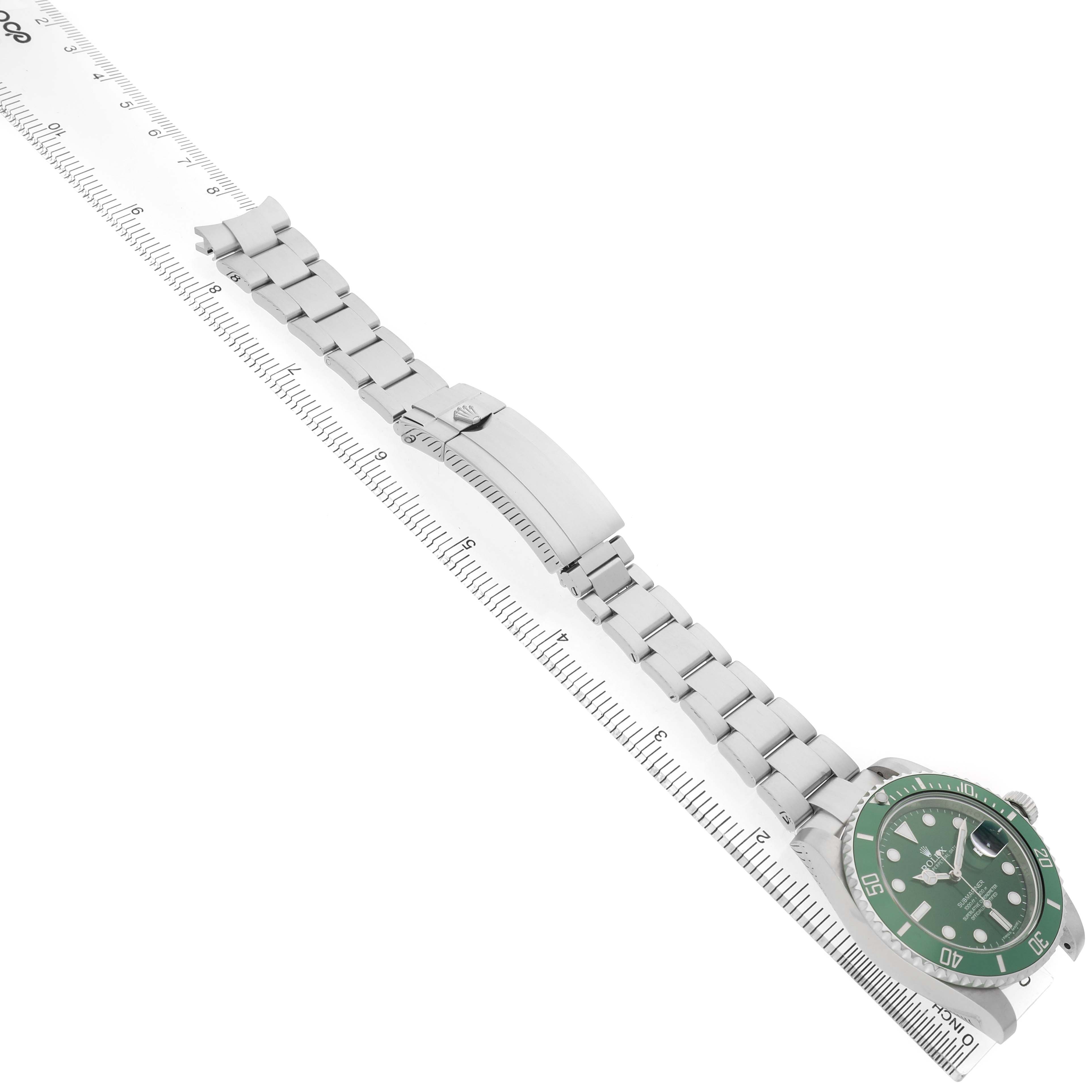 The Rolex Submariner 116610LV Men's Stainless Steel Green Dial watch is shown at a diagonal angle, featuring the full bracelet and the green dial face.