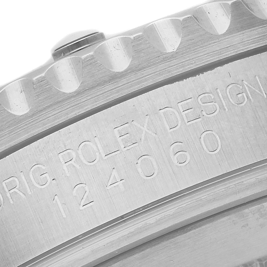 This image shows a close-up of the bezel and engraved model number "124060" of a Rolex Submariner 124060 Men's Stainless Steel Black Dial 124060 Men's Stainless Steel Black Dial watch.