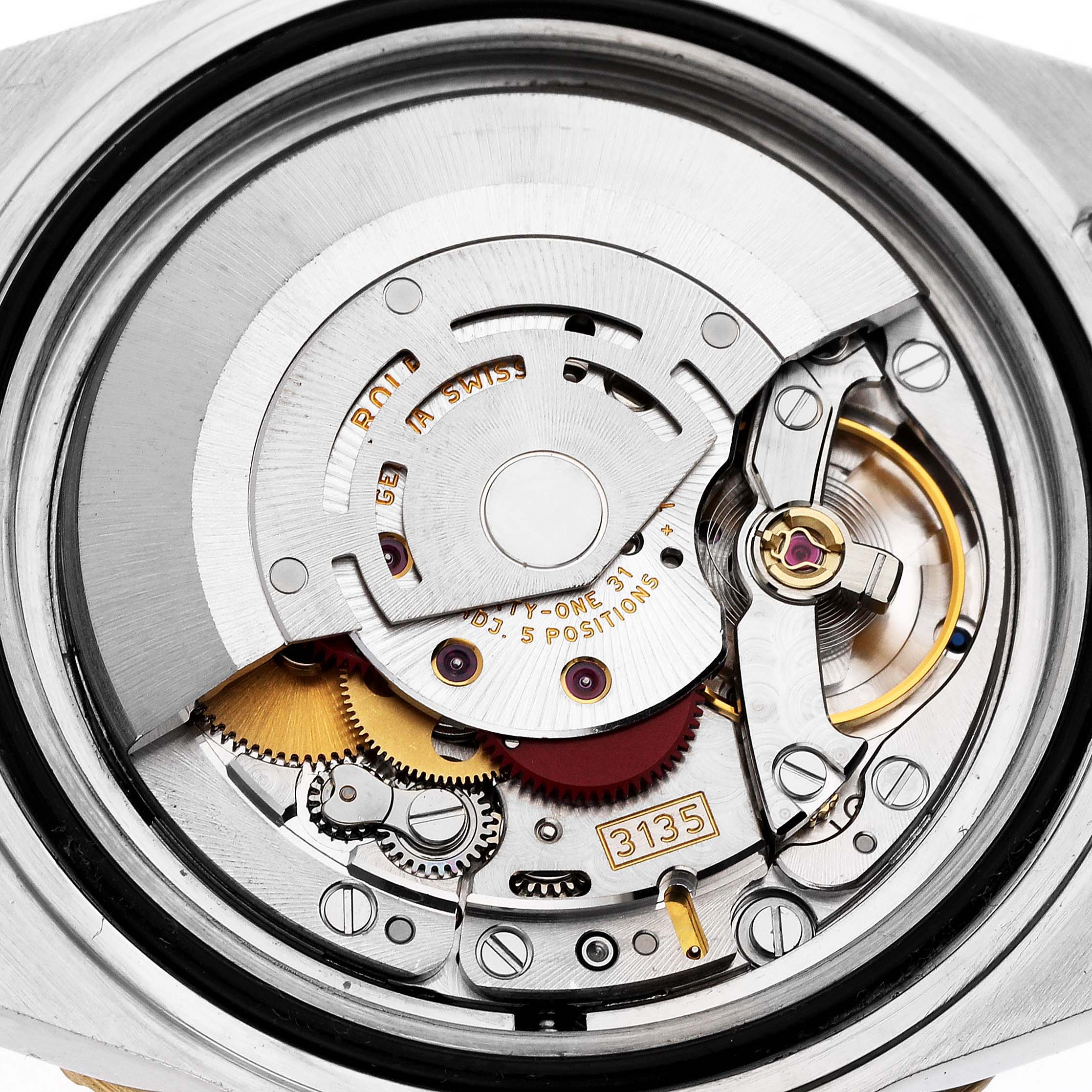 The image shows the movement and internal mechanics of a Rolex Submariner 16613 T Men's Steel and Gold (two tone) Blue Dial watch.