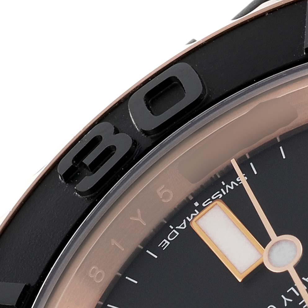 The image shows a close-up of the bezel and part of the dial of a Rolex Yacht-Master 116655 Men's Rose Gold Black Dial 116655 Men's Rose Gold Black Dial watch.