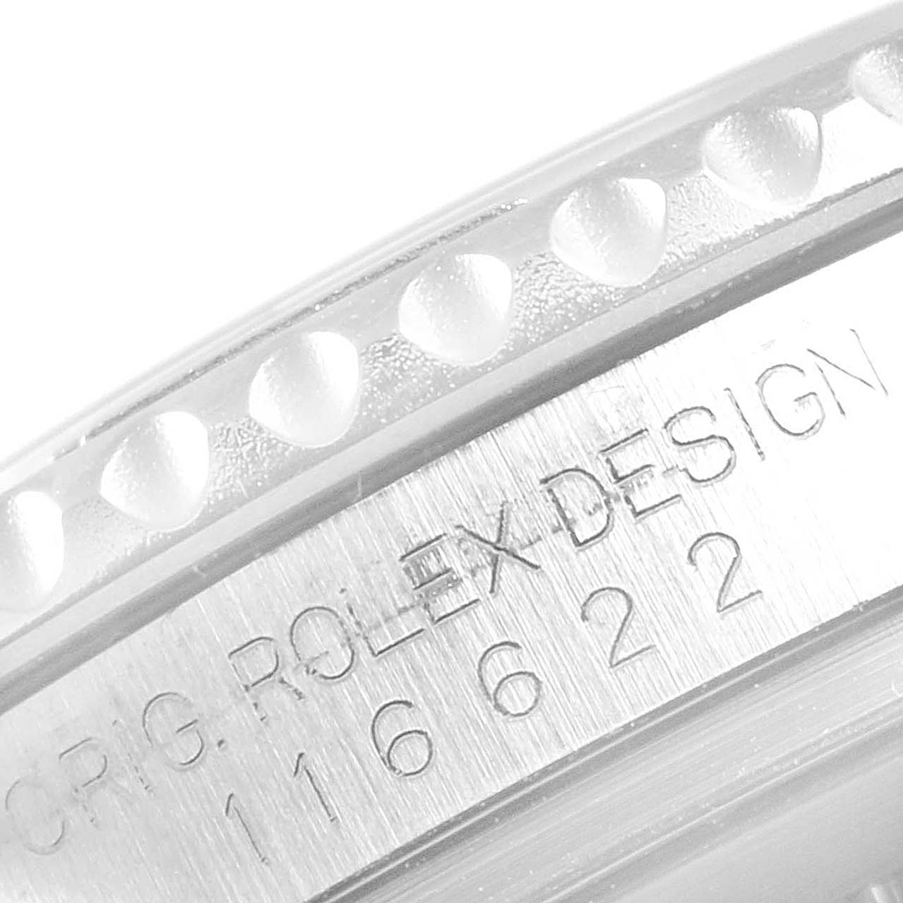 The image shows a close-up of the Rolex Yacht-Master 16622 Men
s Stainless Steel Silver Dial 16622 Men
s Stainless Steel Silver Dial
s case side, featuring engravings and bezel detailing.