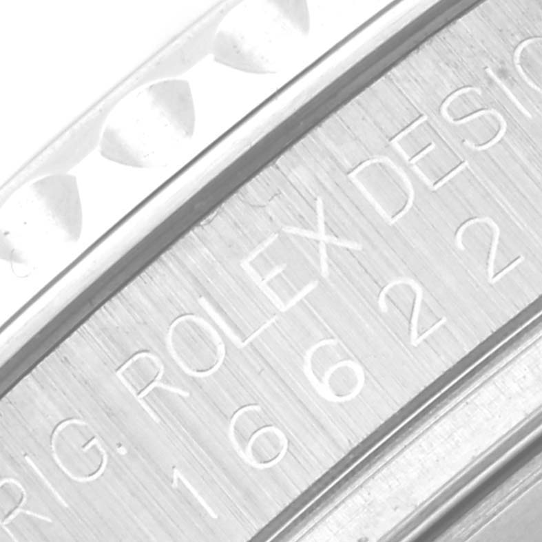 This close-up image of a Rolex Yacht-Master 16622 Men's Stainless Steel Silver Dial 16622 Men's Stainless Steel Silver Dial watch shows part of the case with engraved model details.