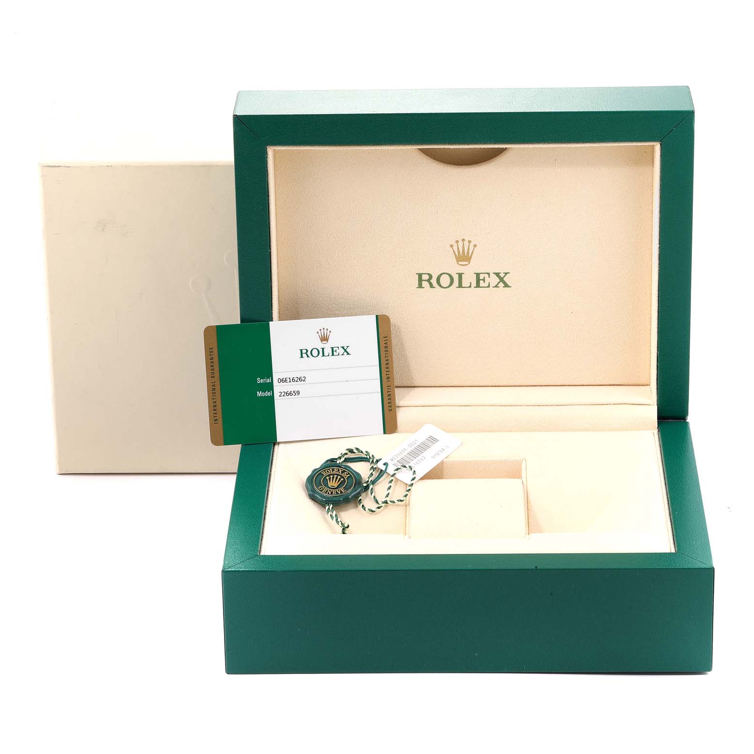 This image shows the packaging box, tags, and warranty card for the Yacht-Master model by Rolex.