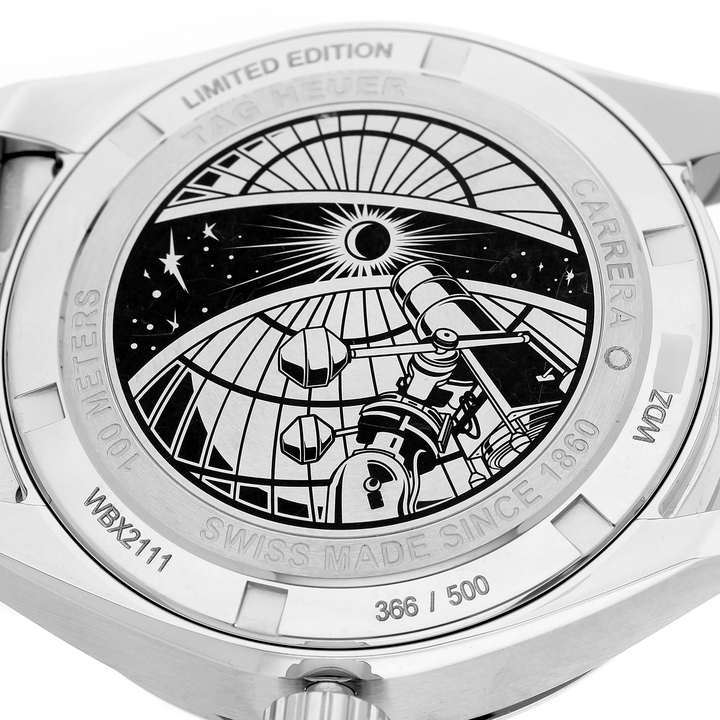 The image shows the back of a Tag Heuer Carrera WBX2111.BD0002 Men's Stainless Steel Silver Dial watch, featuring an engraved celestial design.