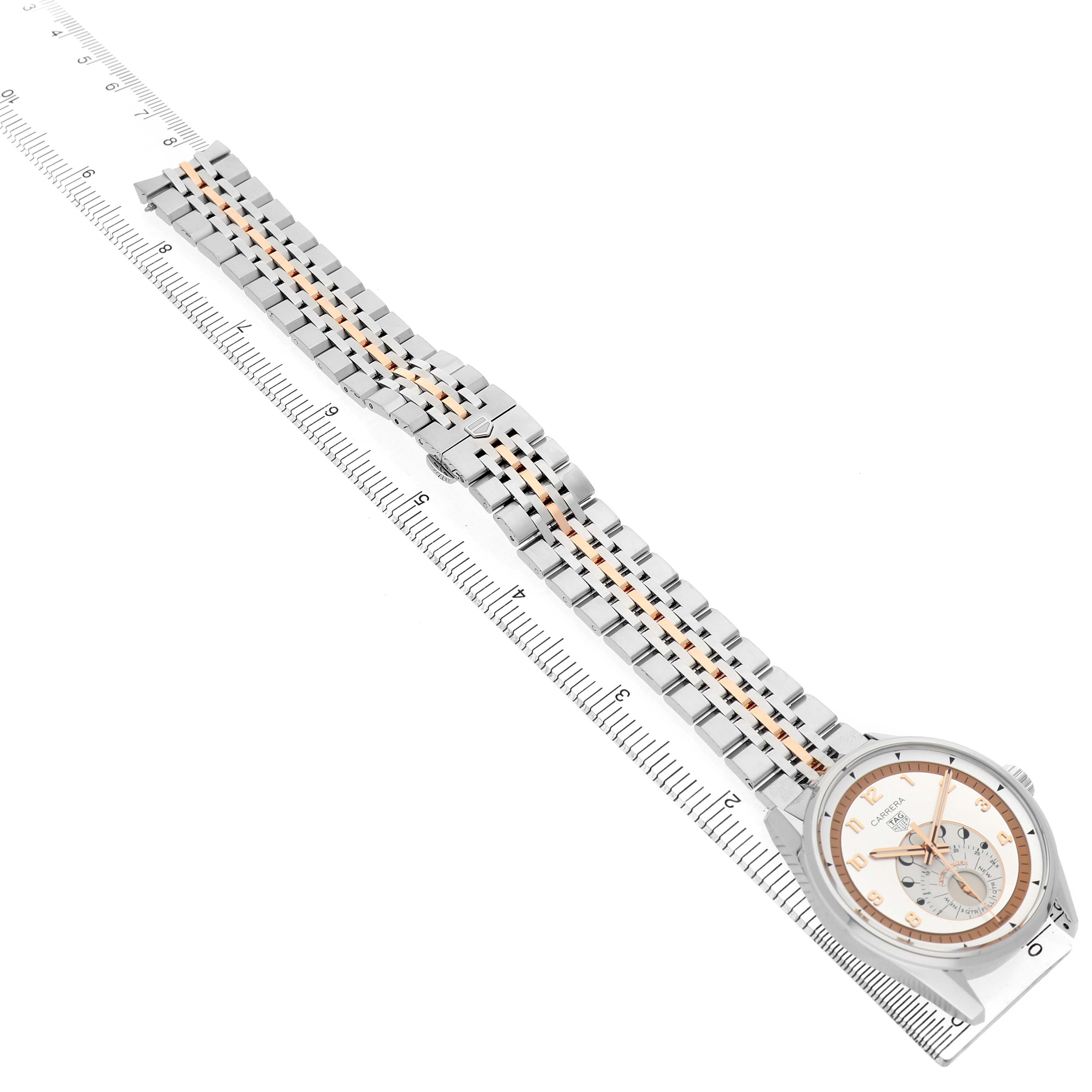 The image shows a Tag Heuer Carrera WBX2111.BD0002 Men's Stainless Steel Silver Dial watch laid flat, highlighting the face and metal bracelet against a ruler.