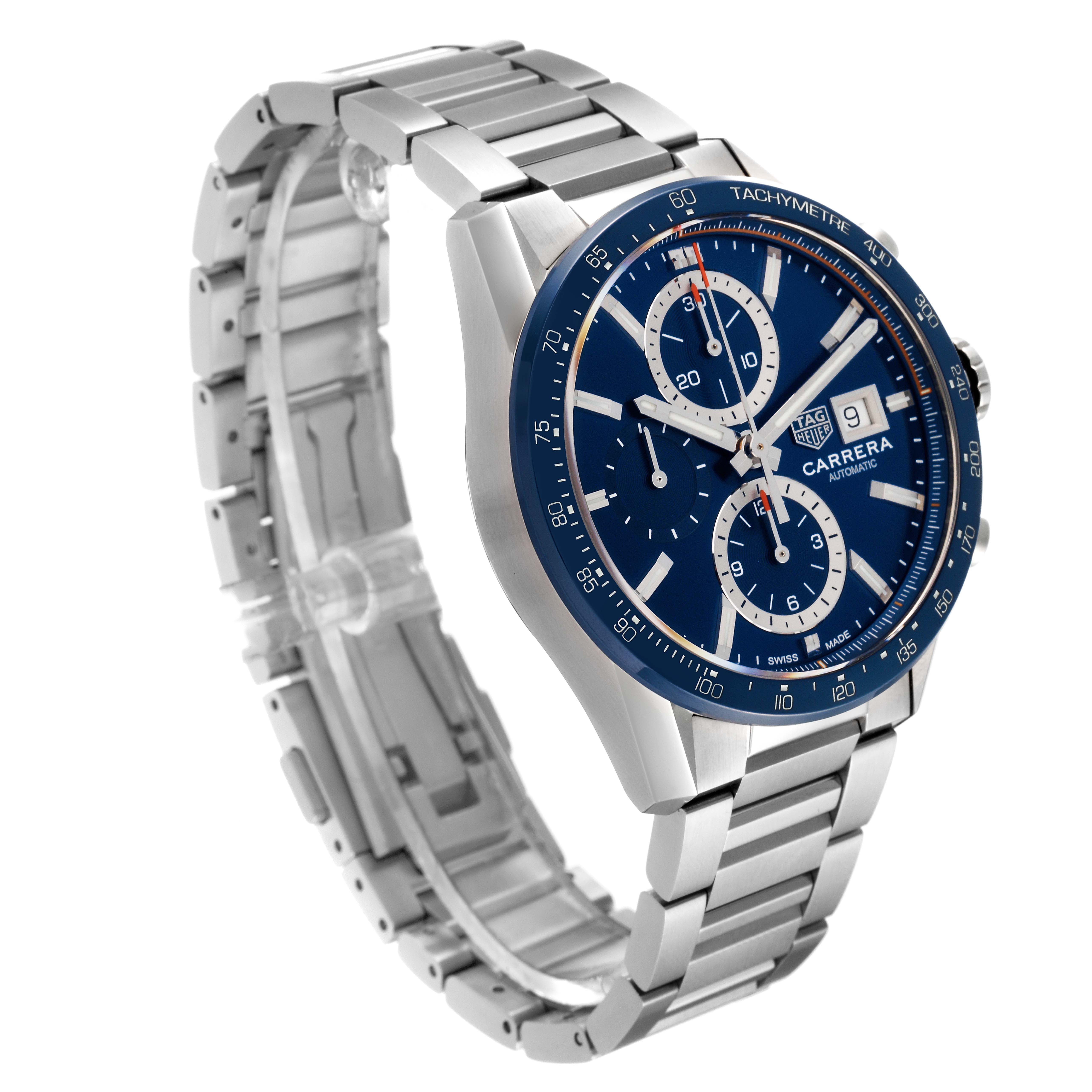 The image shows a Tag Heuer Carrera CBM2112.BA0651 Men's Stainless Steel Blue Dial CBM2112.BA0651 Men's Stainless Steel Blue Dial watch from an oblique angle, highlighting its blue dial, tachymeter, chronograph subdials, and stainless steel bracelet.