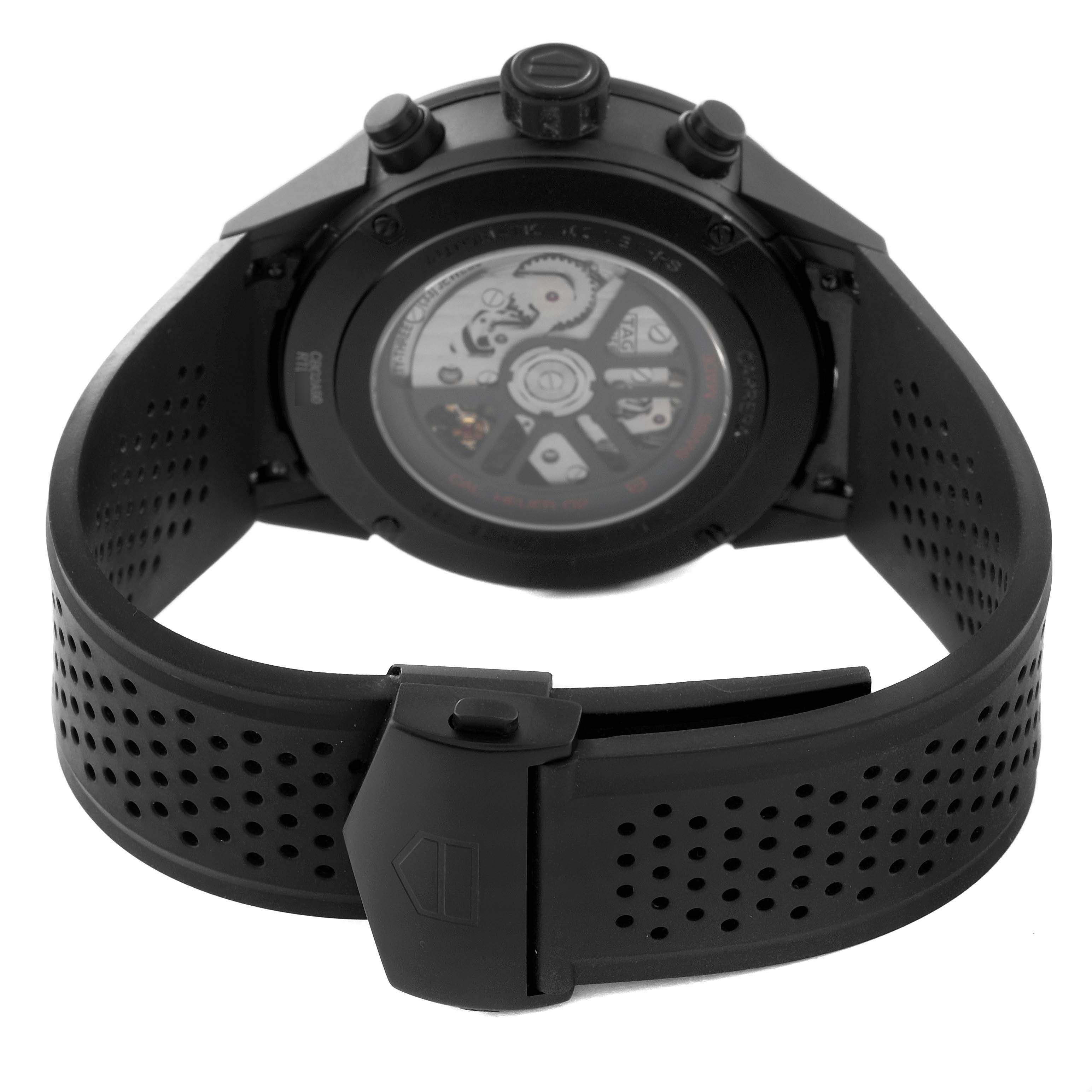 The image shows the rear view of a Tag Heuer Carrera CBG2A90.BH0653 Men's Stainless Steel Black Dial CBG2A90.BH0653 Men's Stainless Steel Black Dial watch, highlighting the case back and perforated rubber strap.