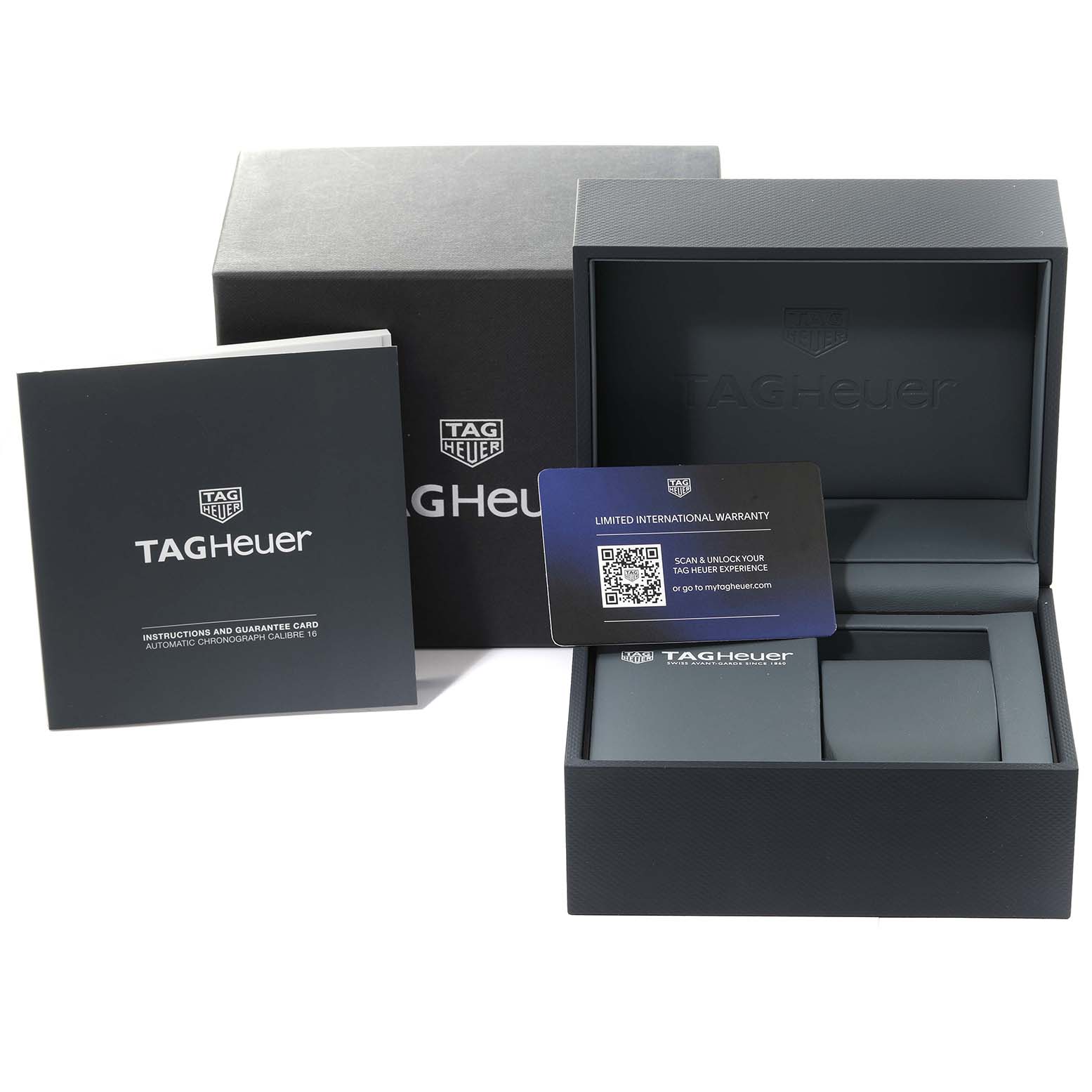 The image shows the packaging, warranty card, and instruction booklet for a Tag Heuer Carrera CV2A84.FC6394 Men's Titanium Black Dial CV2A84.FC6394 Men's Titanium Black Dial watch from a front angle.