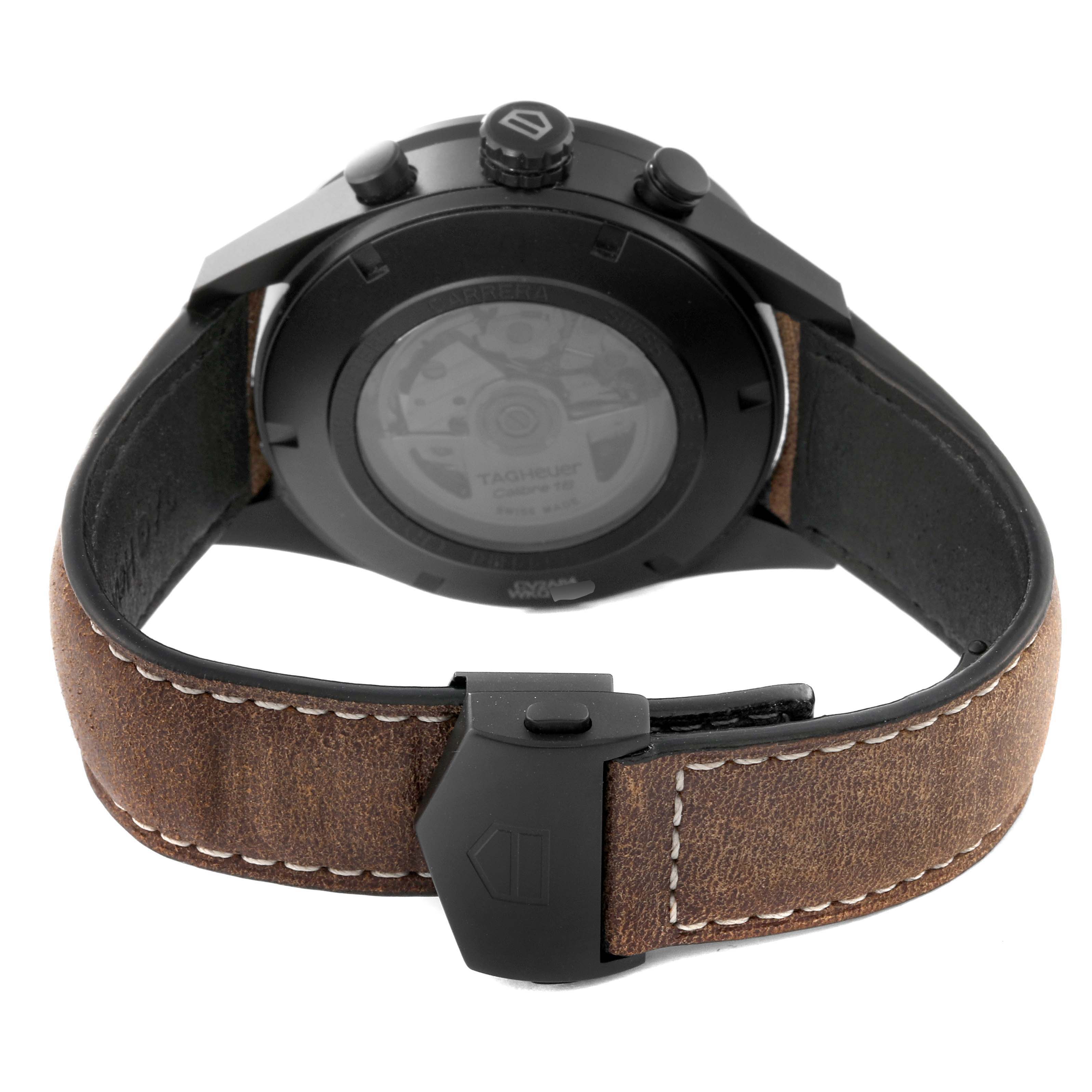 The image shows the rear view of a Tag Heuer Carrera CV2A84.FC6394 Men's Titanium Black Dial CV2A84.FC6394 Men's Titanium Black Dial watch, focusing on the case back, leather strap, and buckle.