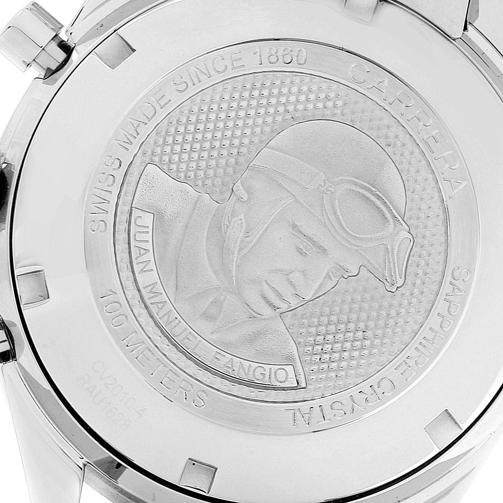 The image shows the back case of a Tag Heuer Carrera CV2010-3 Men
s Stainless Steel Black Dial CV2010-3 Men
s Stainless Steel Black Dial watch, featuring an engraved design of Juan Manuel Fangio.