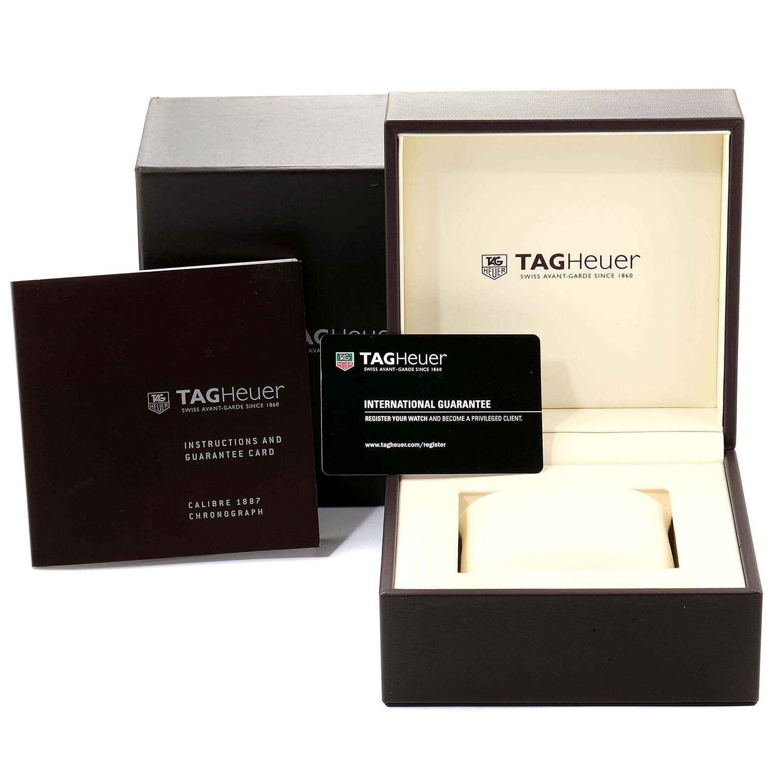 The image shows a Tag Heuer Carrera CV2010-3 Men
s Stainless Steel Black Dial CV2010-3 Men
s Stainless Steel Black Dial watch box, guarantee card, and instruction booklet.