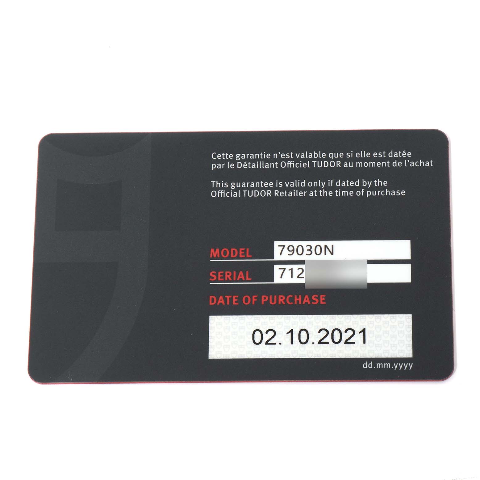 This image shows a guarantee card for the Tudor Heritage Black Bay 79030N Men's Stainless Steel Black Dial 79030N Men's Stainless Steel Black Dial watch model 79030N with the date of purchase.