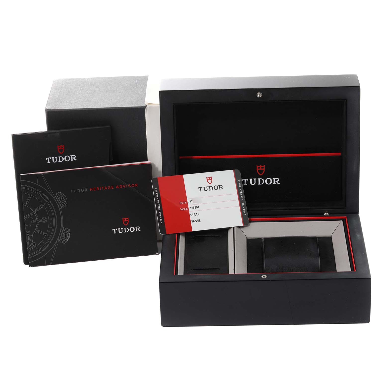 The image shows the packaging, manuals, and warranty card for a Tudor Heritage Advisor M79620T-0001 Men's Stainless Steel Silver Dial M79620T-0001 Men's Stainless Steel Silver Dial watch, with an open watch box.