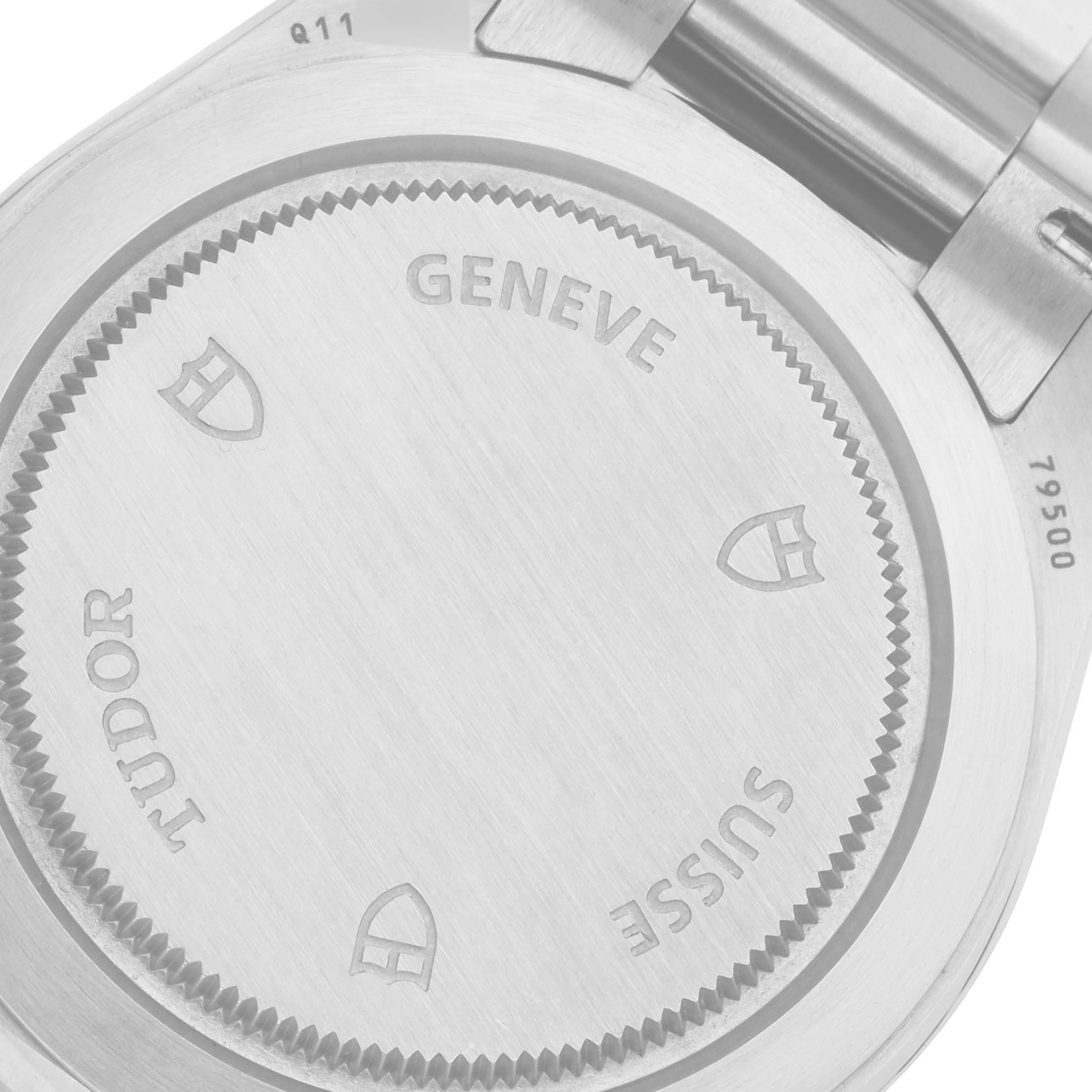 This image shows the back case of a Tudor Heritage Black Bay 79500 Men's Stainless Steel Silver Dial 79500 Men's Stainless Steel Silver Dial watch, highlighting engravings and the stainless steel surface.