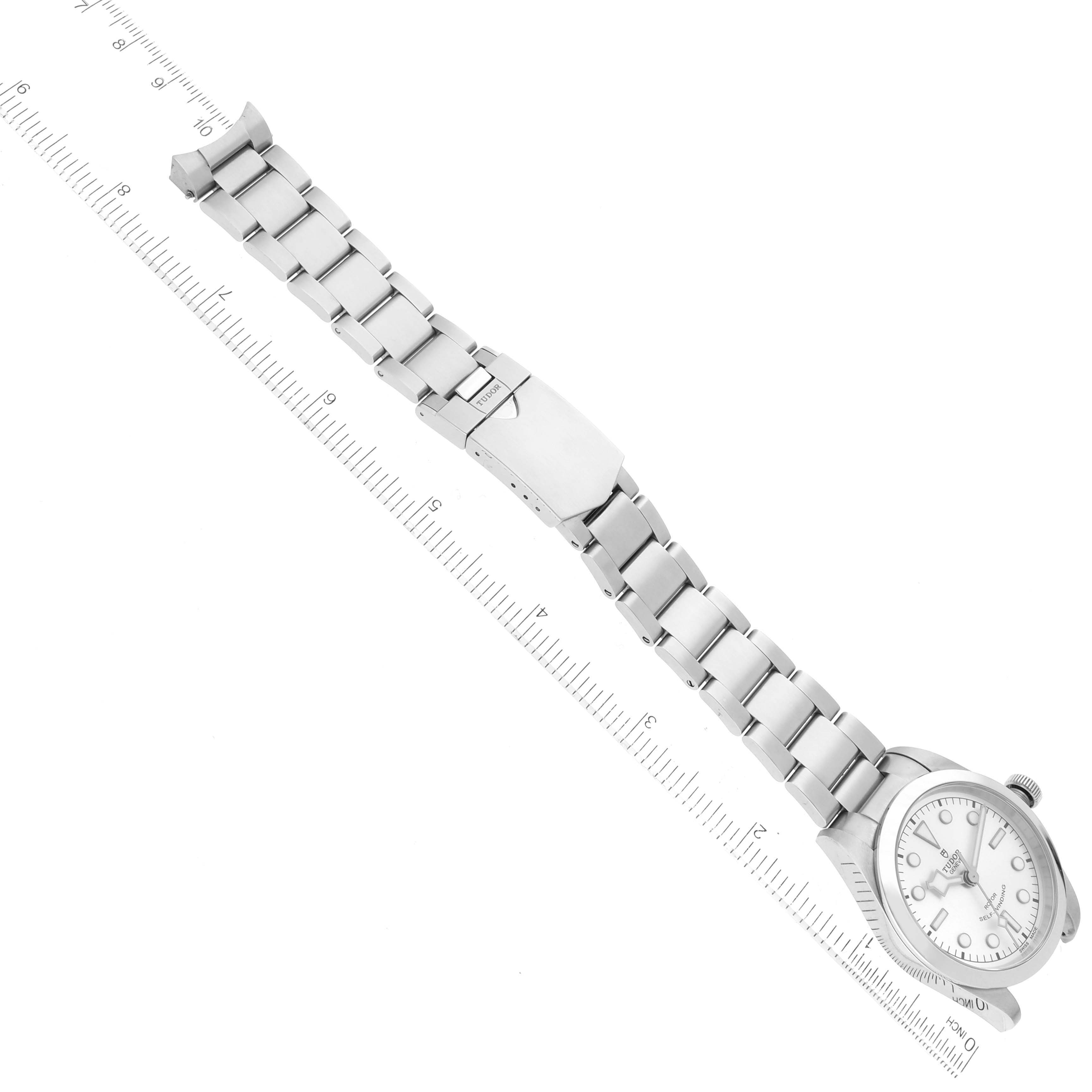 The image shows a side view of the Tudor Heritage Black Bay 79500 Men's Stainless Steel Silver Dial 79500 Men's Stainless Steel Silver Dial watch with its full metal bracelet extended and a clasp.