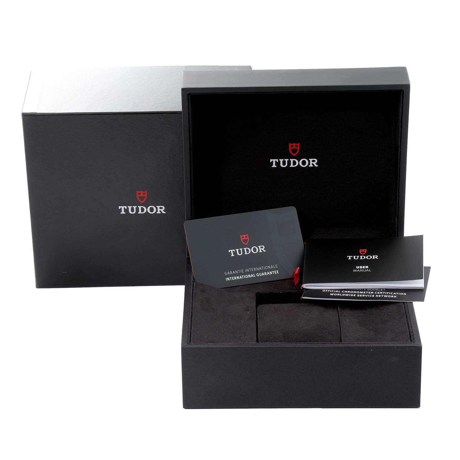 The image shows the Tudor Heritage Black Bay 79830RB Men's Stainless Steel Black Dial 79830RB Men's Stainless Steel Black Dial watch box, international guarantee card, and user manual from a front angle.