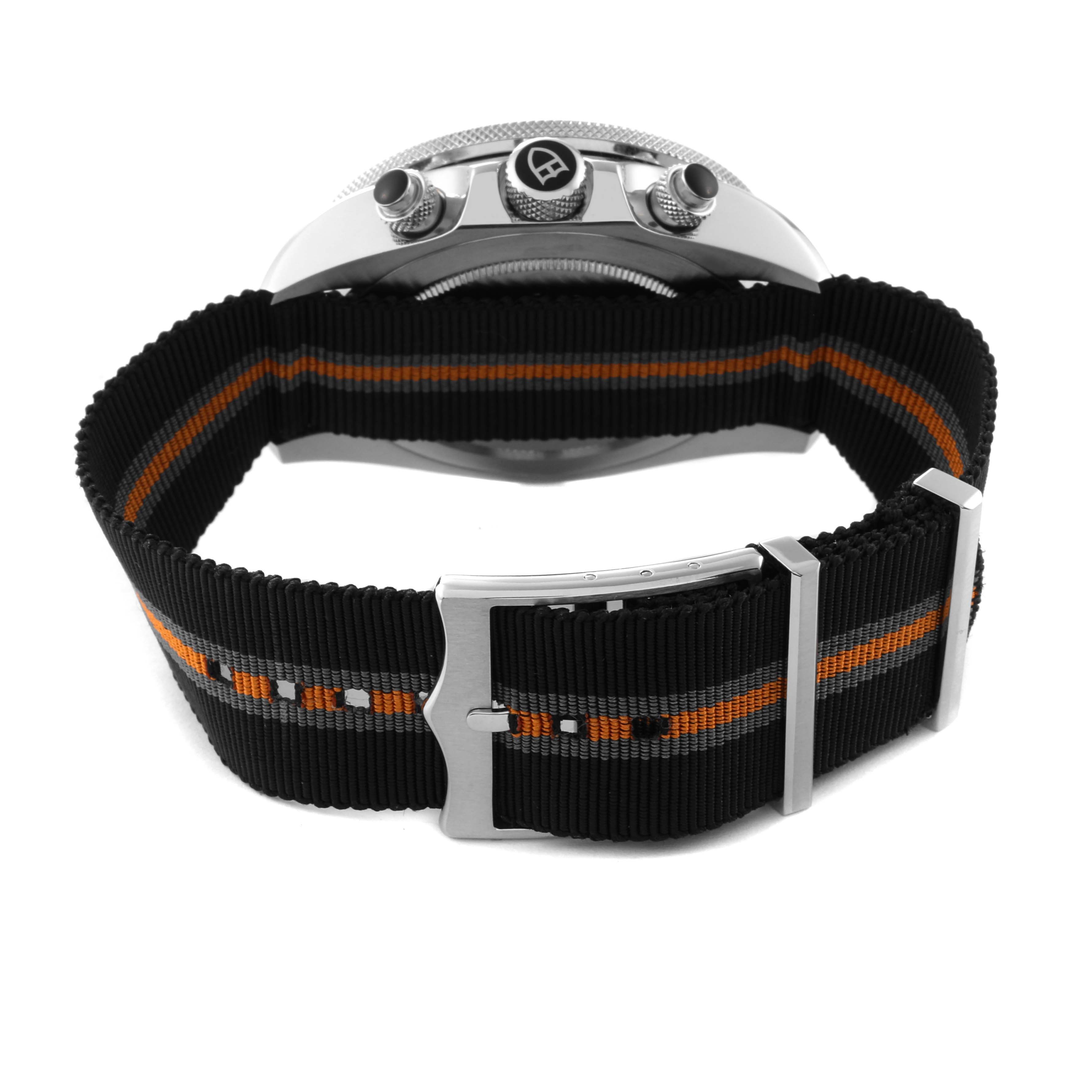 The image shows the Tudor Heritage Chrono 70330N Men's Stainless Steel Grey Dial 70330N Men's Stainless Steel Grey Dial watch from the back, highlighting the nylon strap and clasp.