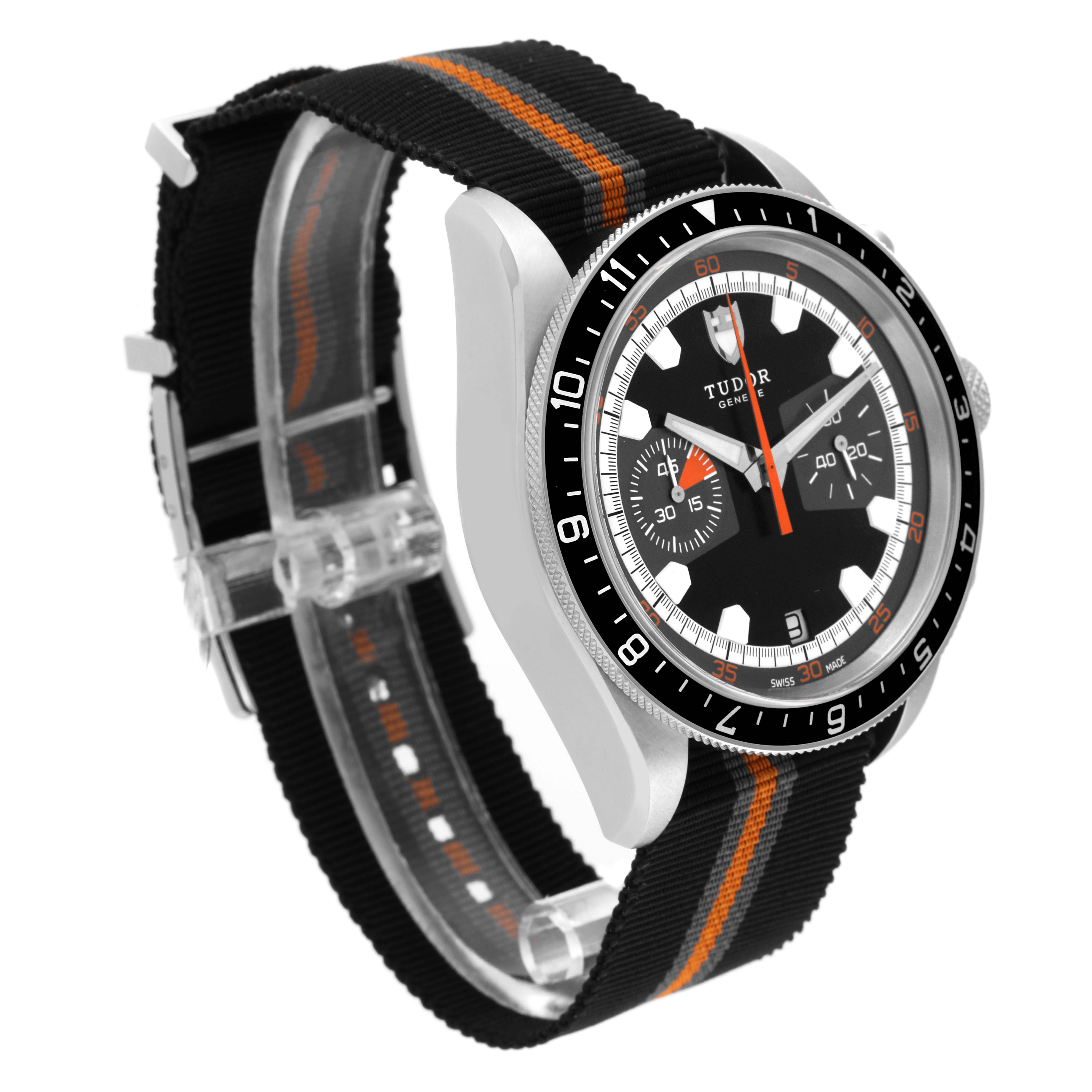 This image displays a Tudor Heritage Chrono 70330N Men's Stainless Steel Grey Dial 70330N Men's Stainless Steel Grey Dial watch from a front diagonal angle, showcasing its dial, bezel, and fabric strap.