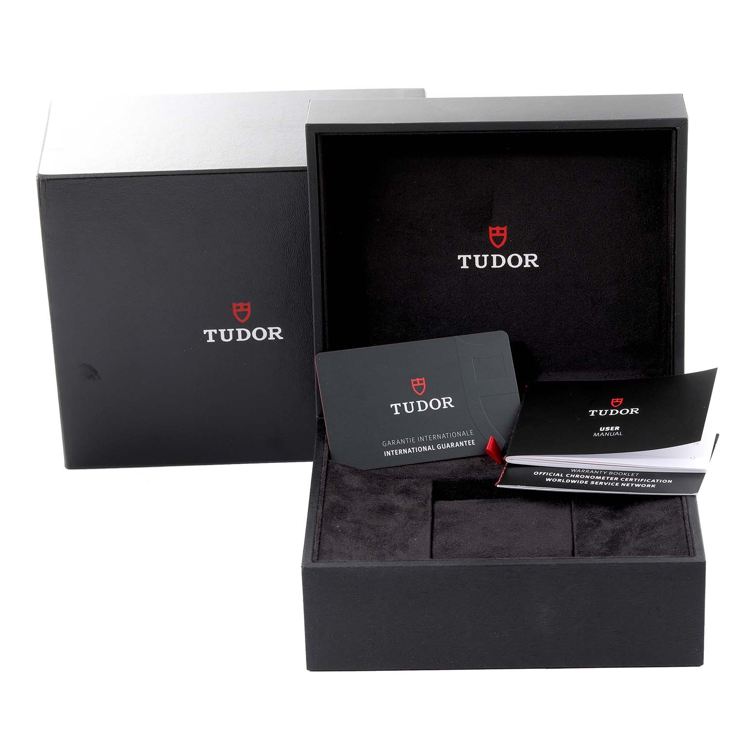 The image shows the packaging, warranty card, and user manual for the Tudor Heritage Chrono 70330N Men's Stainless Steel Grey Dial 70330N Men's Stainless Steel Grey Dial watch.
