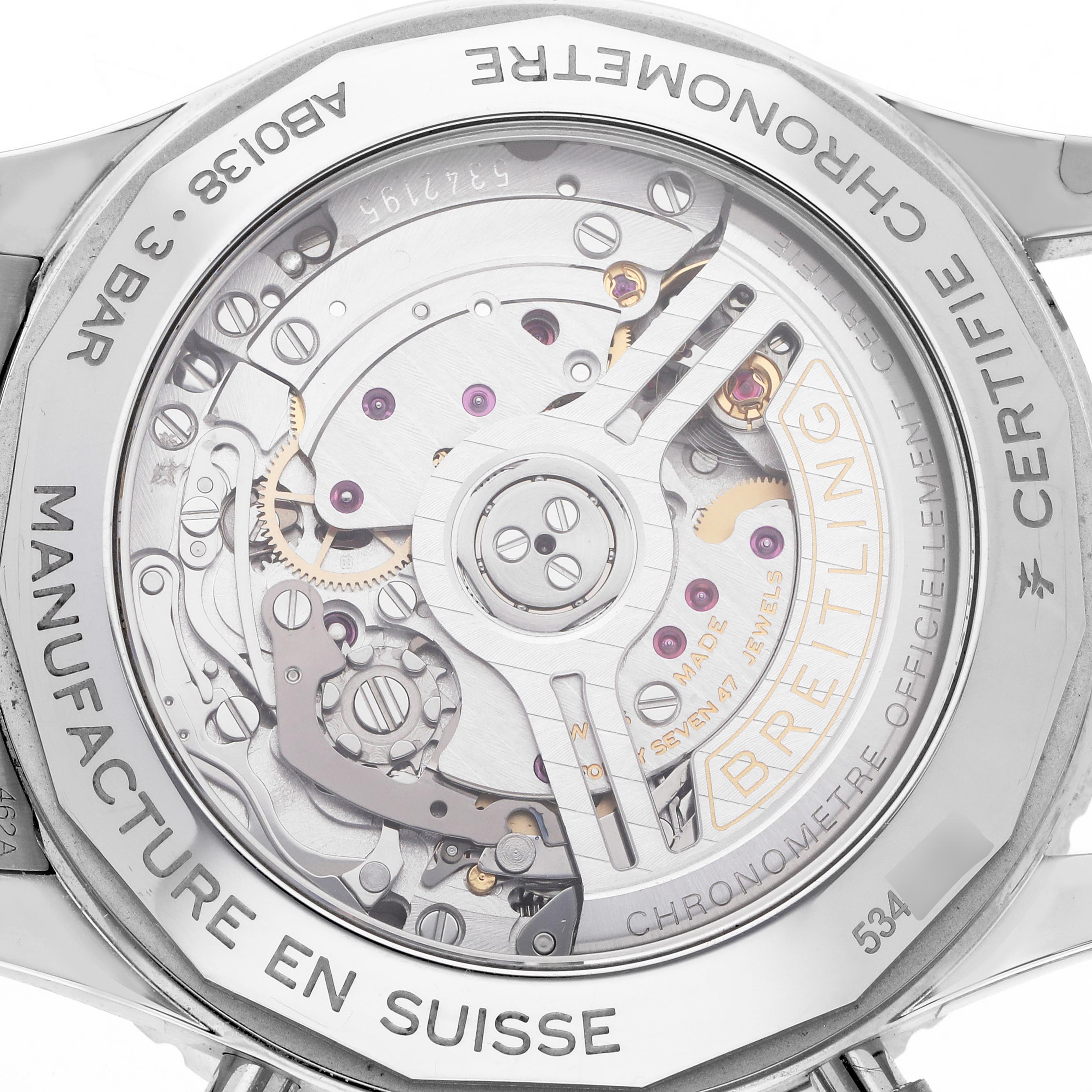 The image shows the backside of a Breitling Navitimer AB0138 Men
s Stainless Steel Blue Dial AB0138 Men
s Stainless Steel Blue Dial watch, revealing its intricate mechanical movement and engravings.