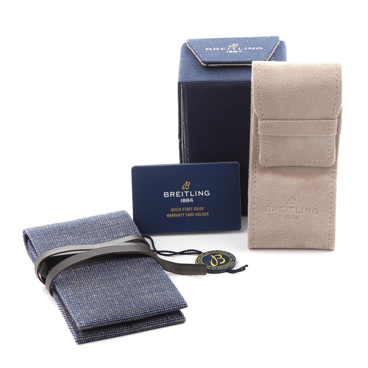 The image shows packaging and accessories for a Breitling Navitimer AB0138 Men
s Stainless Steel Blue Dial AB0138 Men
s Stainless Steel Blue Dial, including a box, a suede pouch, a fabric wrap, and a warranty card.