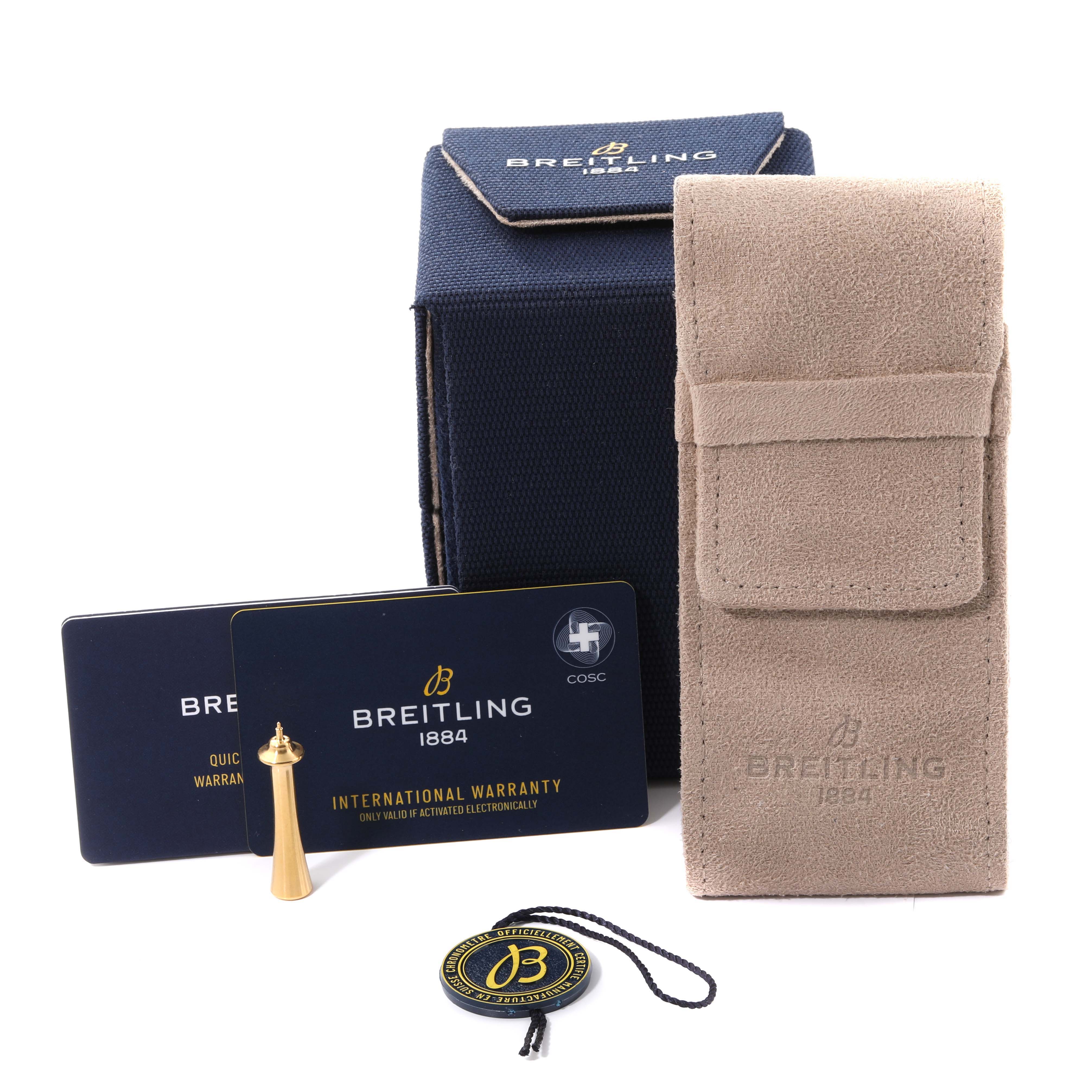 The image shows watch accessories for the Breitling Premier AB2510201K1P1 Men's Stainless Steel Pink Dial AB2510201K1P1 Men's Stainless Steel Pink Dial model, including warranty cards, a display box, and a travel pouch.