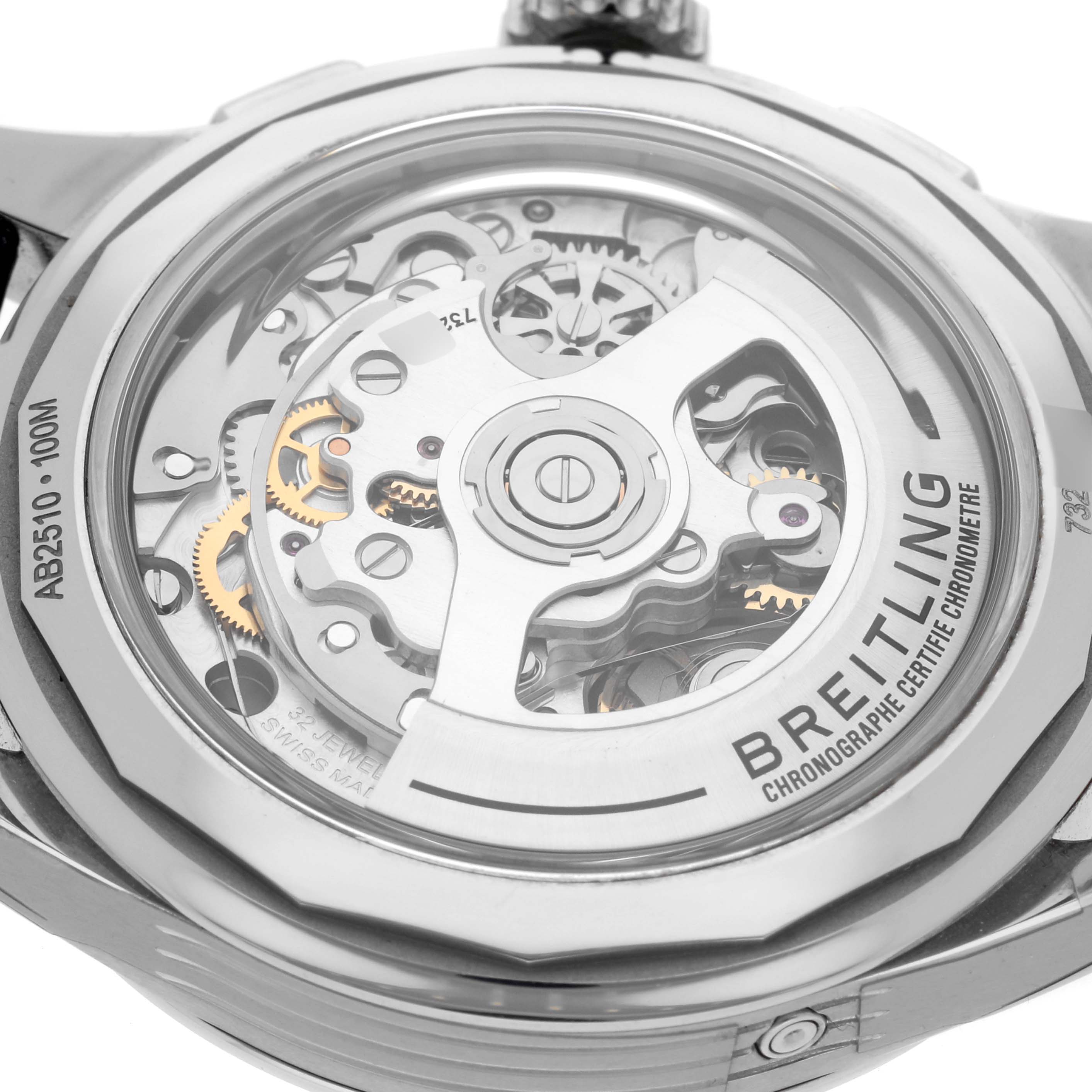 The image shows the back view of the Breitling Premier AB2510201K1P1 Men's Stainless Steel Pink Dial AB2510201K1P1 Men's Stainless Steel Pink Dial watch, revealing its intricate mechanical movement and gears.