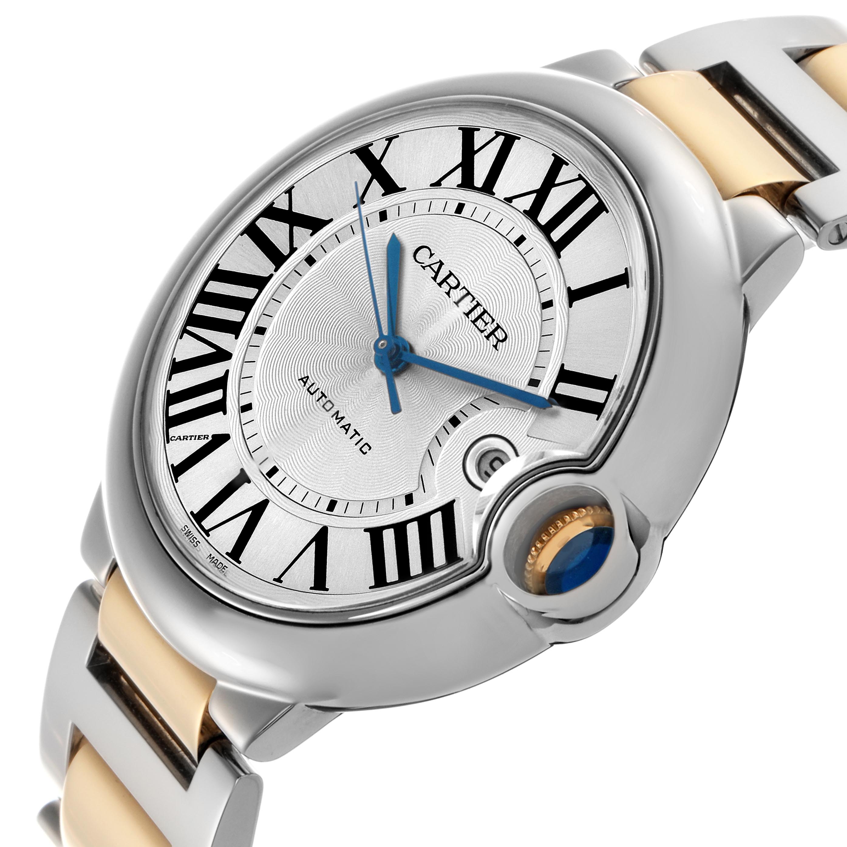 The Cartier Ballon Bleu W69009Z3 Men
s Steel and Gold (two tone) Silver Dial W69009Z3 Men
s Steel and Gold (two tone) Silver Dial watch is shown at an angle highlighting the dial, Roman numerals, blue hands, and crown with a blue cabochon.