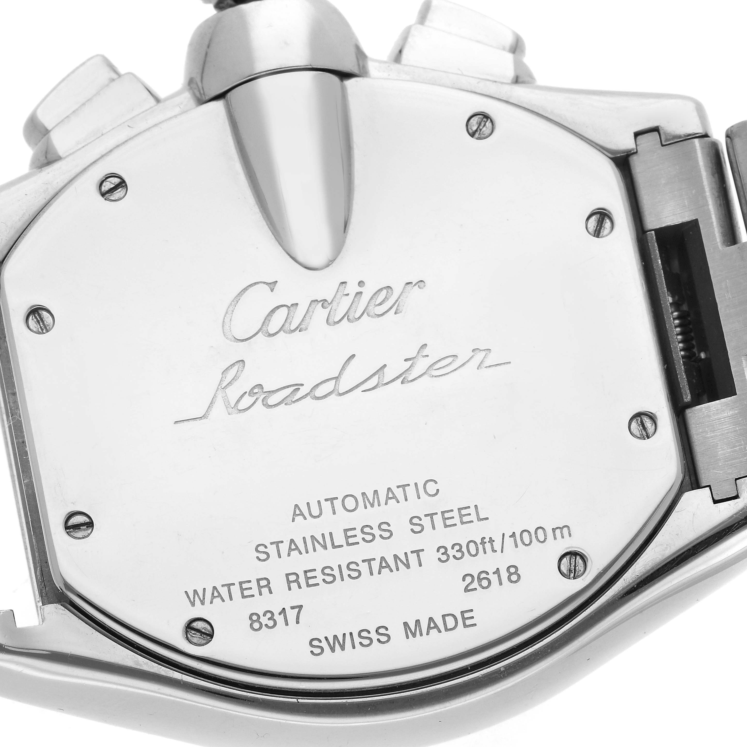 The image shows the back of a Cartier Roadster W62019X6 Men
s Stainless Steel Silver Dial W62019X6 Men
s Stainless Steel Silver Dial watch featuring engravings and screws, displaying brand details and specifications.