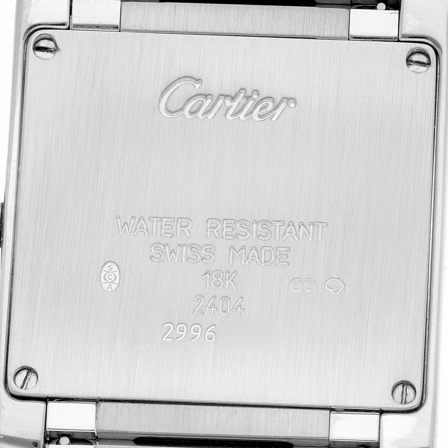 The image shows the back of a Cartier Tank Francaise WE1014SC Women's White Gold Pink Dial WE1014SC Women's White Gold Pink Dial watch with its engraved details and screws.