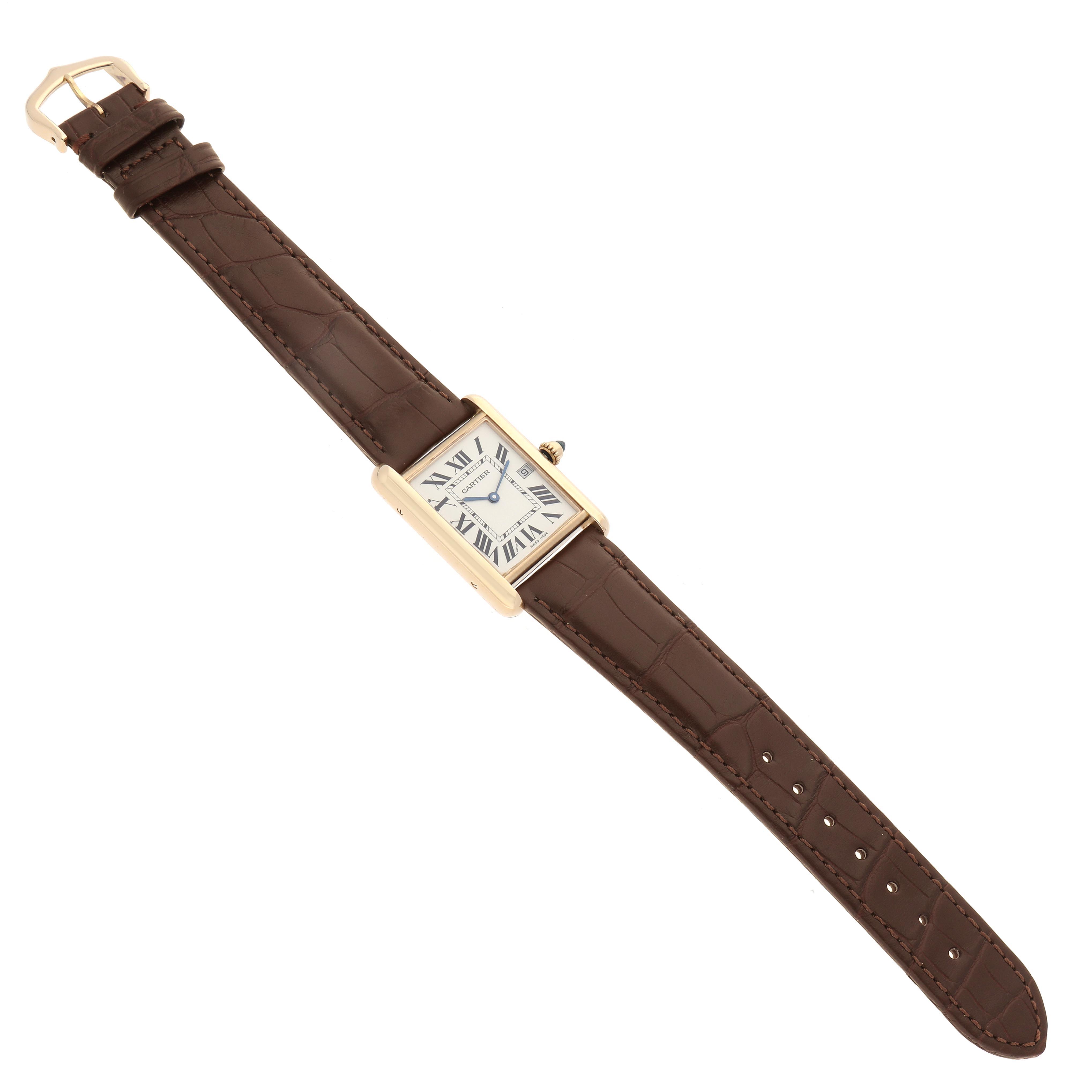 The Cartier Tank Louis W1529756 Men's Yellow Gold Silver Dial W1529756 Men's Yellow Gold Silver Dial watch is shown at a slight angle, displaying the rectangular face, leather strap, buckle, and crown.