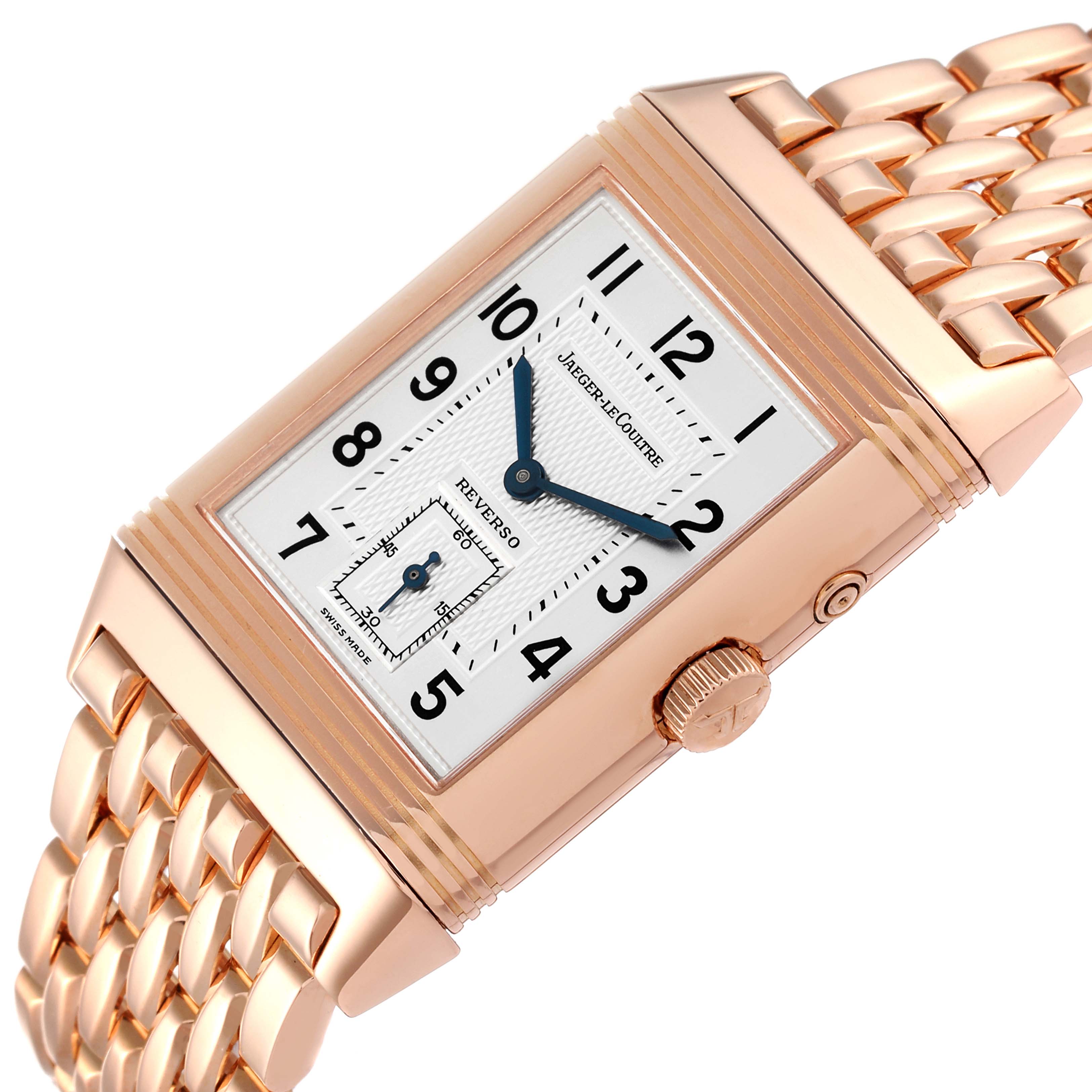 The Jaeger LeCoultre Reverso Q2702121 Men's Rose Gold Silver Dial Q2702121 Men's Rose Gold Silver Dial watch is shown at an angle highlighting the dial, crown, and part of the bracelet.