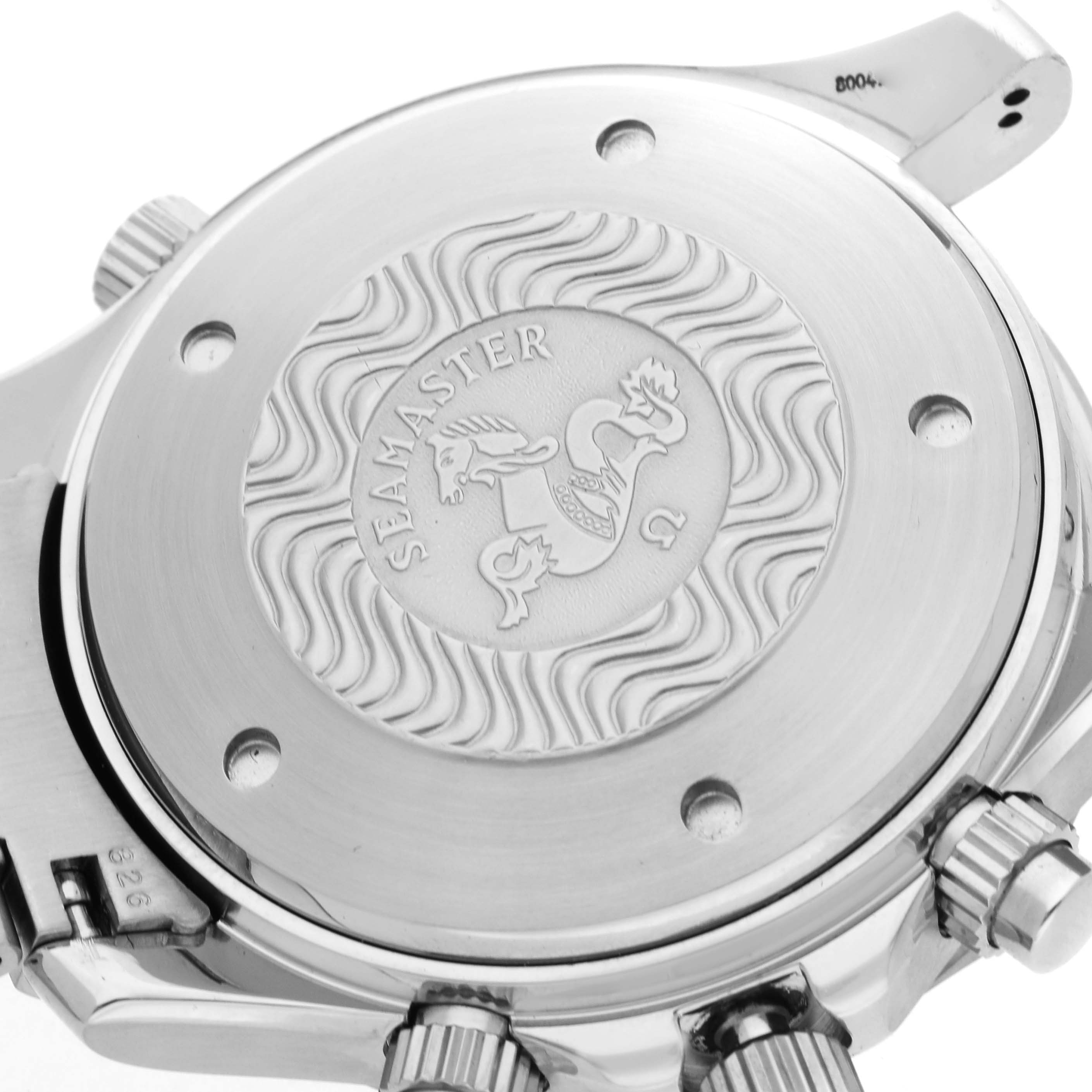 The image shows the back case of an Omega Seamaster 2599.80.00 Men
s Stainless Steel Blue Dial 2599.80.00 Men
s Stainless Steel Blue Dial watch, displaying its engraved design and the crown on the side.