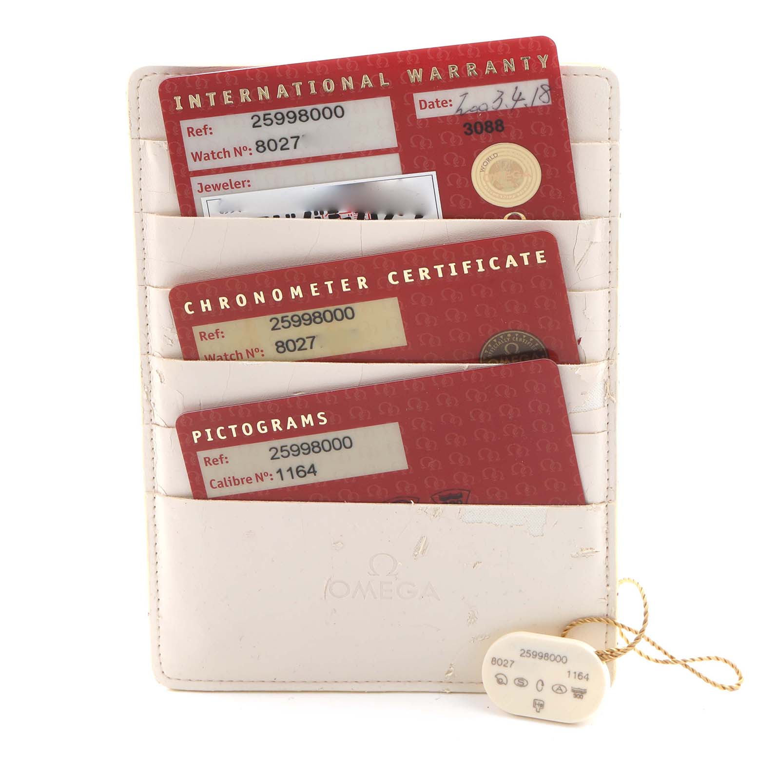 The image shows warranty cards and a tag for the Omega Seamaster 2599.80.00 Men
s Stainless Steel Blue Dial 2599.80.00 Men
s Stainless Steel Blue Dial, displayed from the top angle in a cardholder.