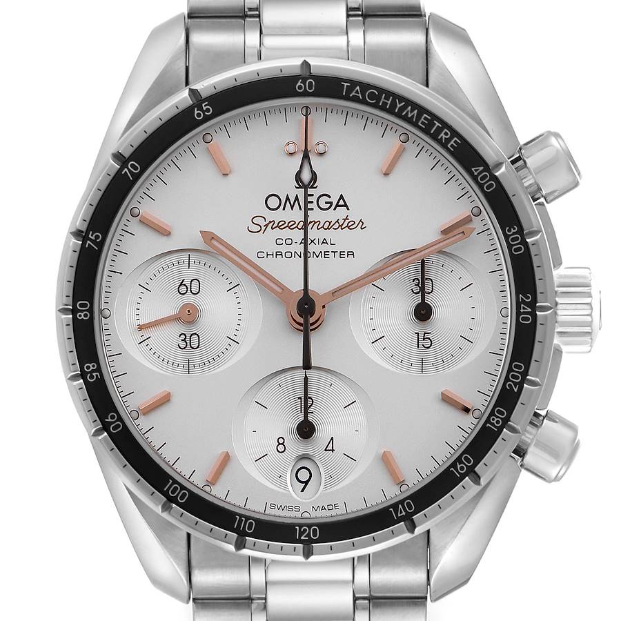 The Omega Speedmaster watch is shown from the front, highlighting its dial, tachymeter bezel, subdials, and stainless steel bracelet.