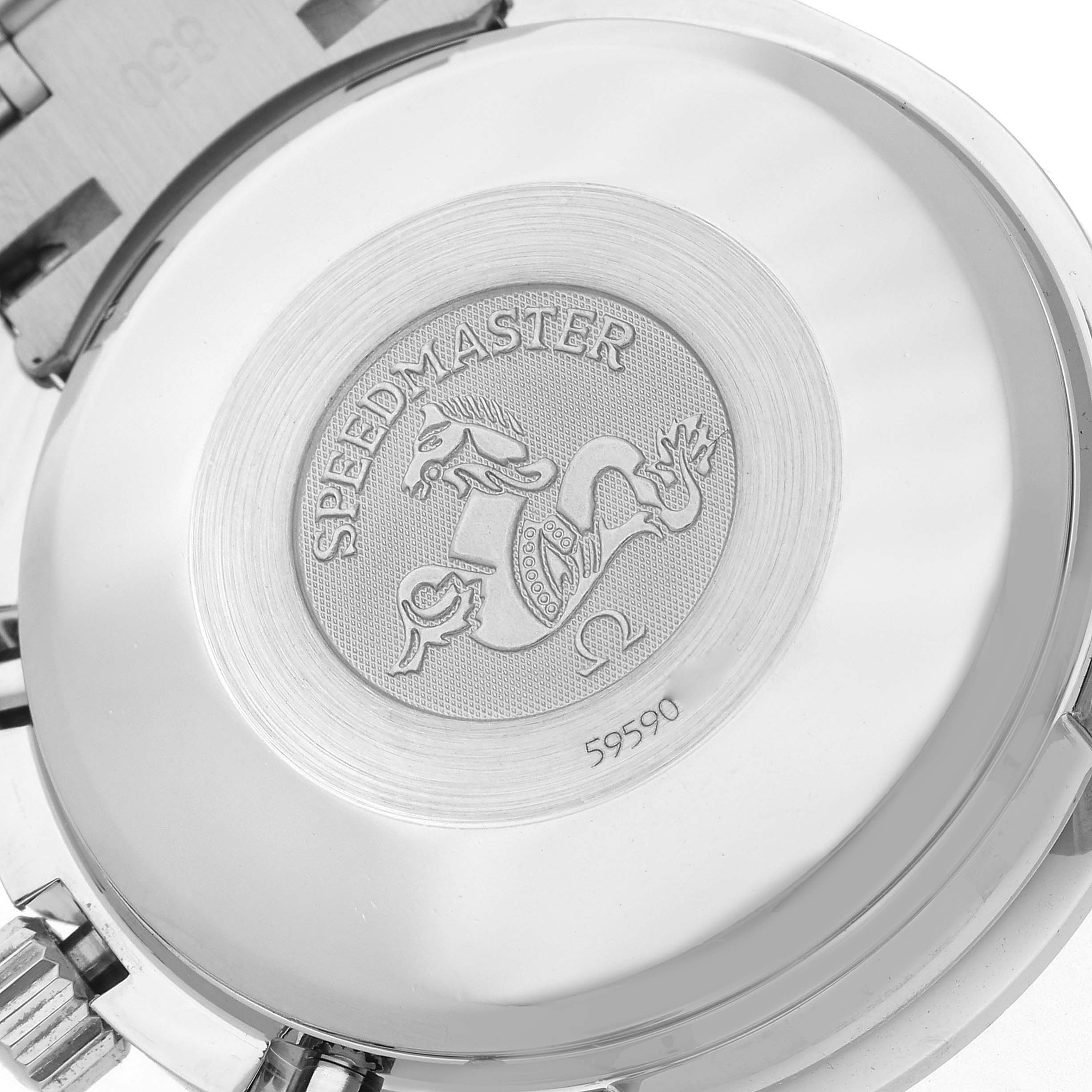 The image shows the case back of an Omega Speedmaster 3523.80.00 Men
s Stainless Steel Blue Dial 3523.80.00 Men
s Stainless Steel Blue Dial watch, featuring an engraved emblem and text.