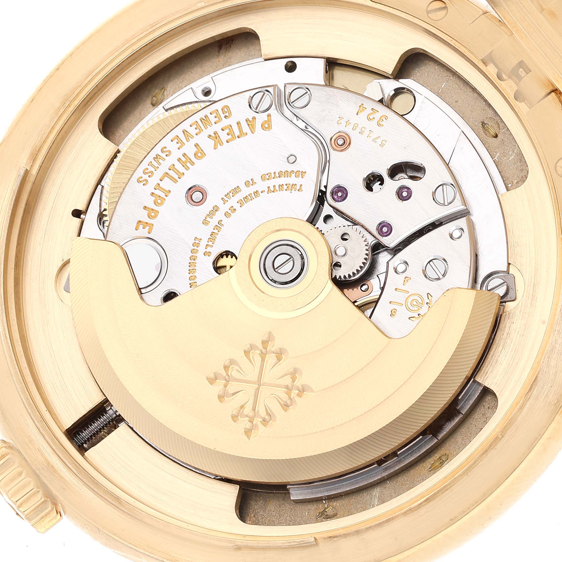 The image shows the intricate mechanics of the watch movement inside a Patek Philippe Calatrava 5227J-001 Men's Yellow Gold Beige Dial 5227J-001 Men's Yellow Gold Beige Dial model from a top-down angle.