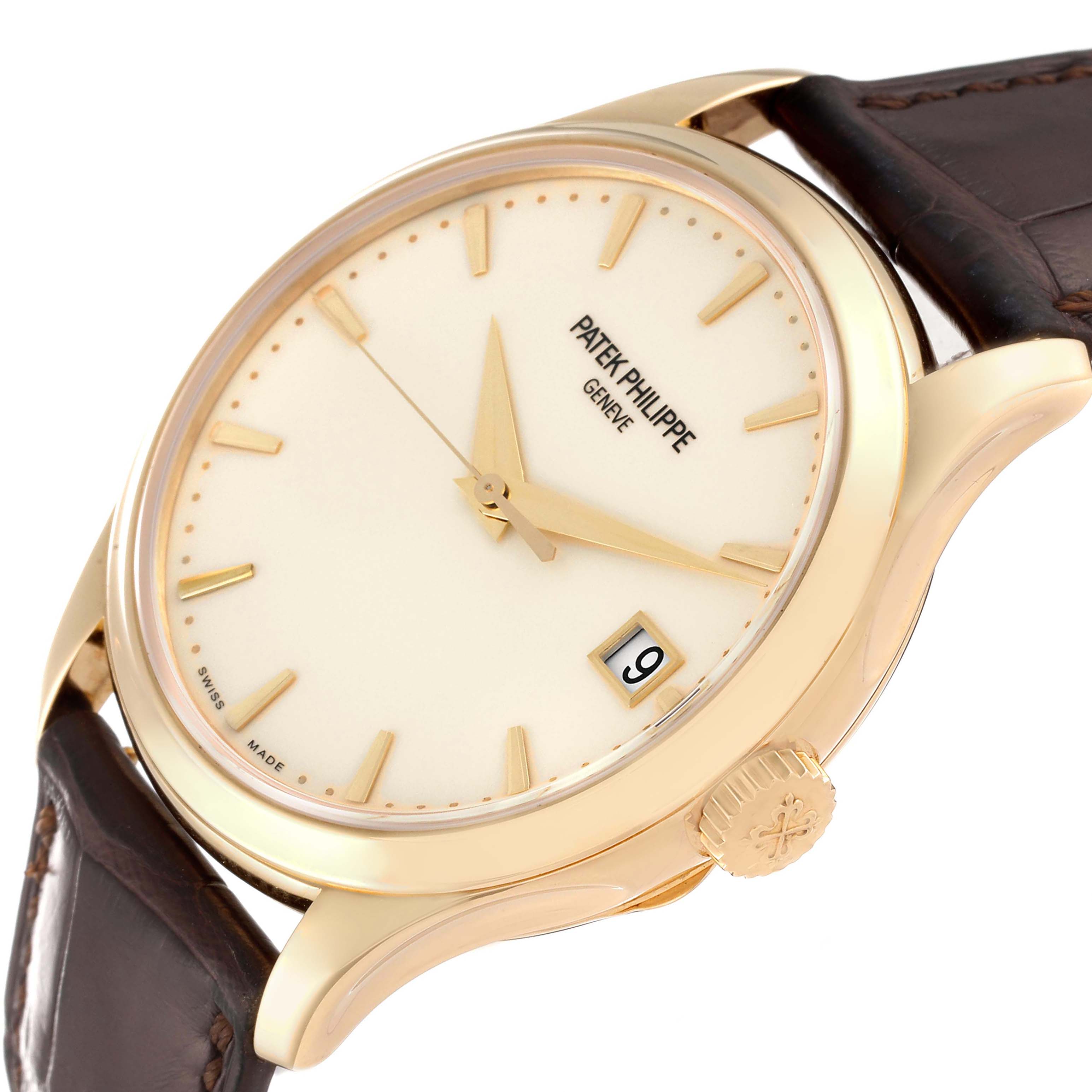 The image shows a close-up of the Patek Philippe Calatrava 5227J-001 Men's Yellow Gold Beige Dial 5227J-001 Men's Yellow Gold Beige Dial watch, focusing on the dial, hands, date display, and crown.